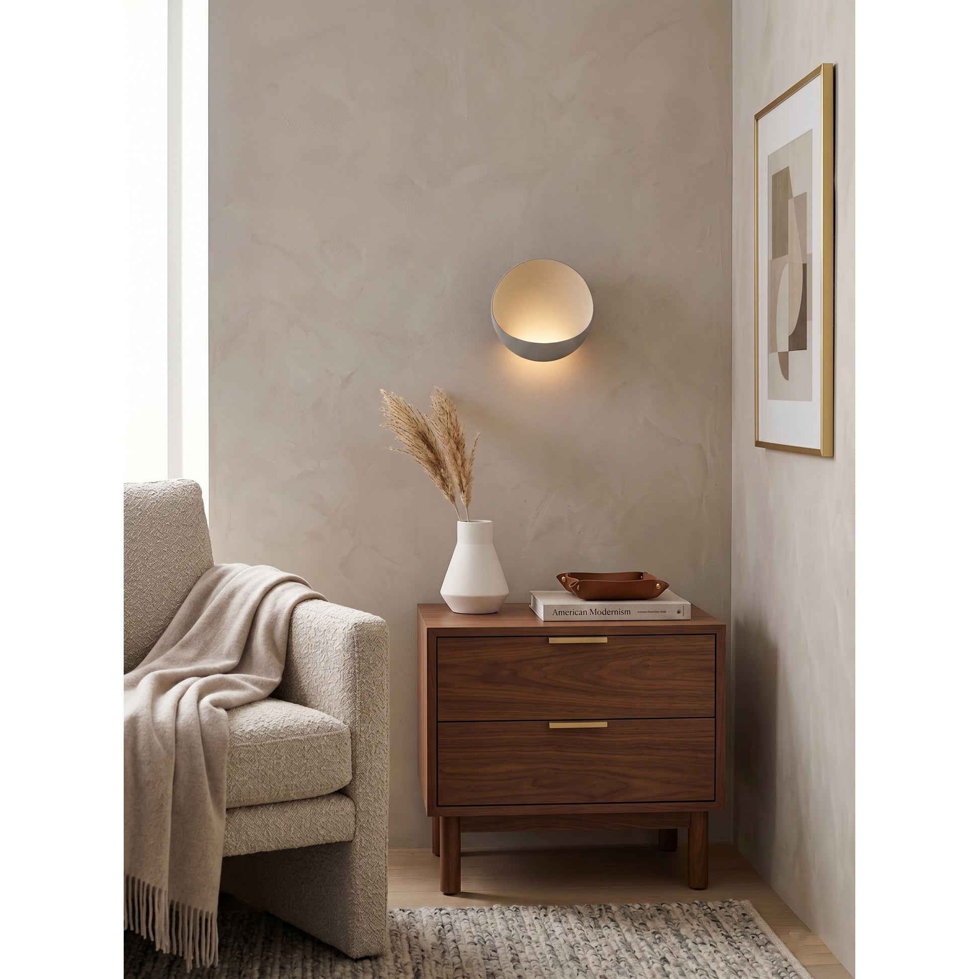 Brick red Flindt sconce against a dark, textured wall.