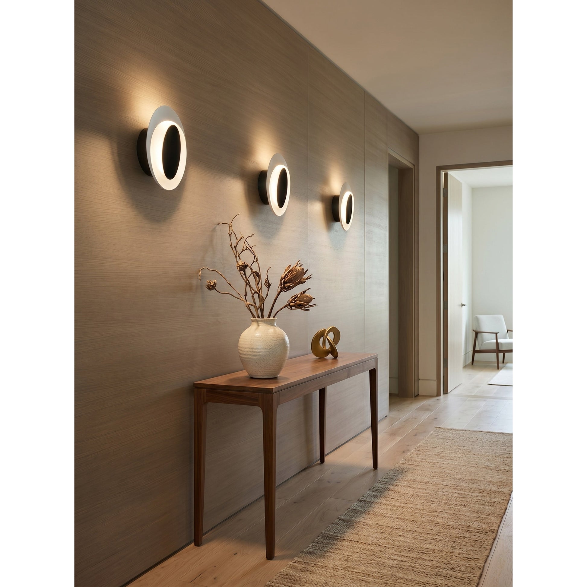Installation view showing the mounting of the Flindt sconce.