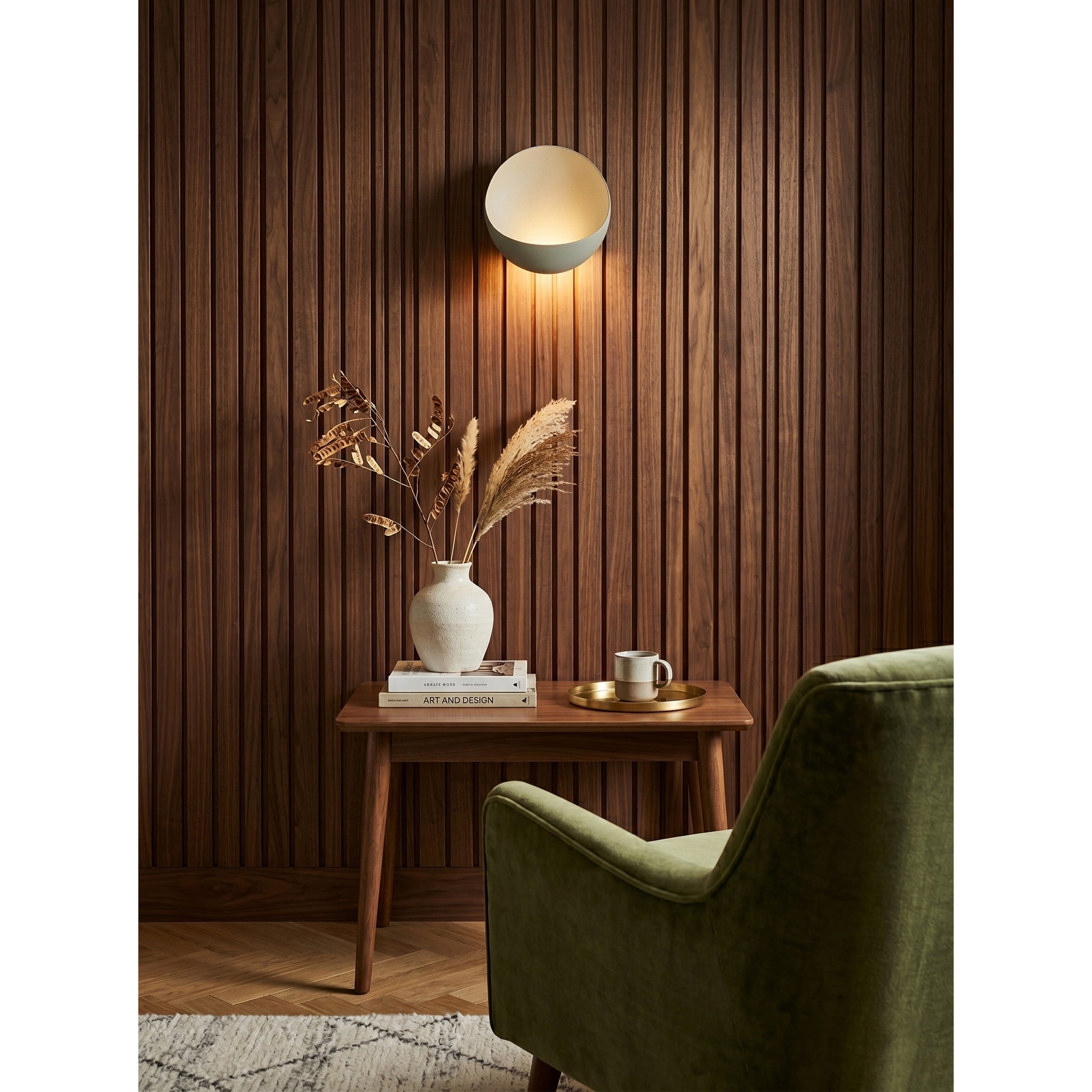 Multiple Flindt sconces in various colors displayed together.