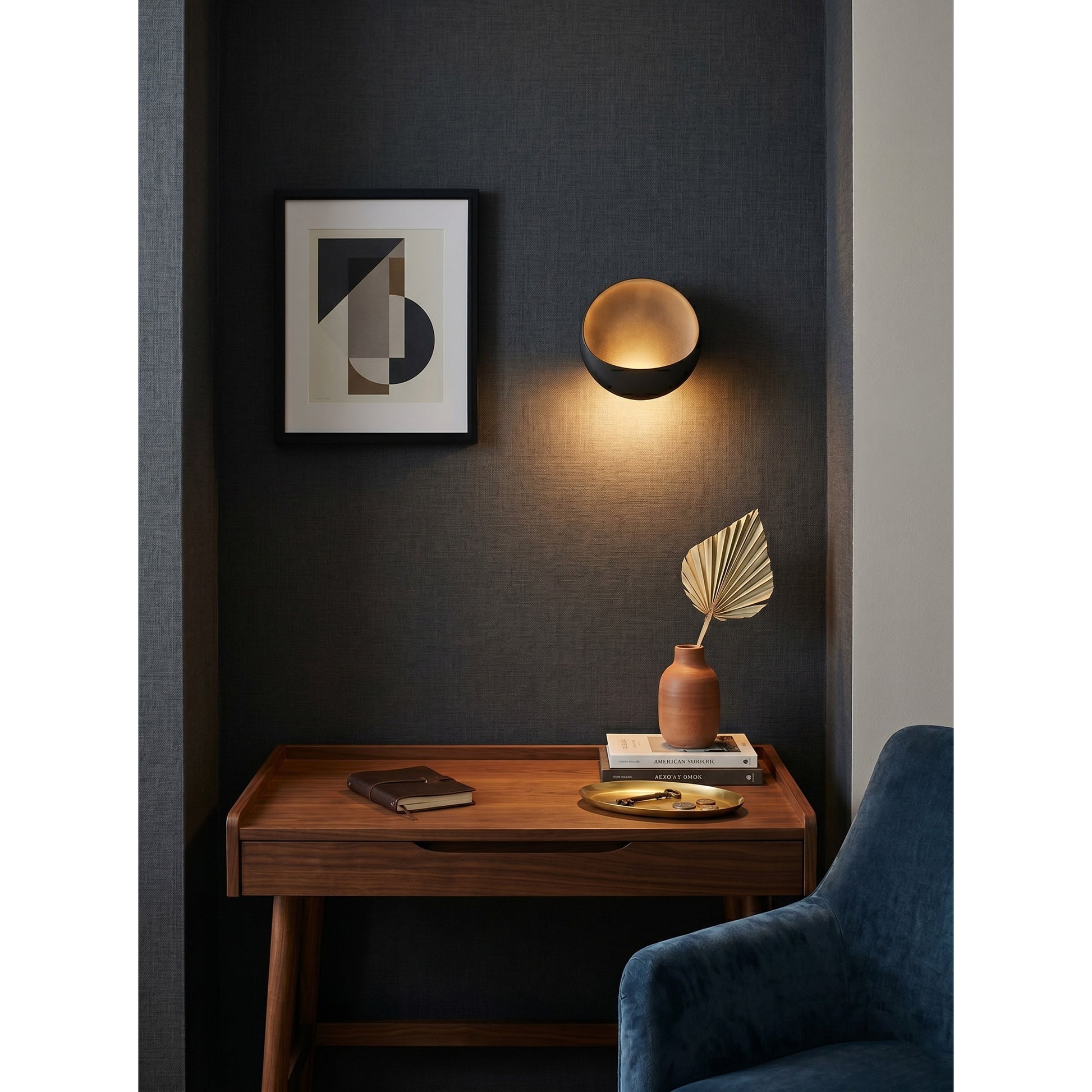 White Flindt sconce casting a warm 3000K light.