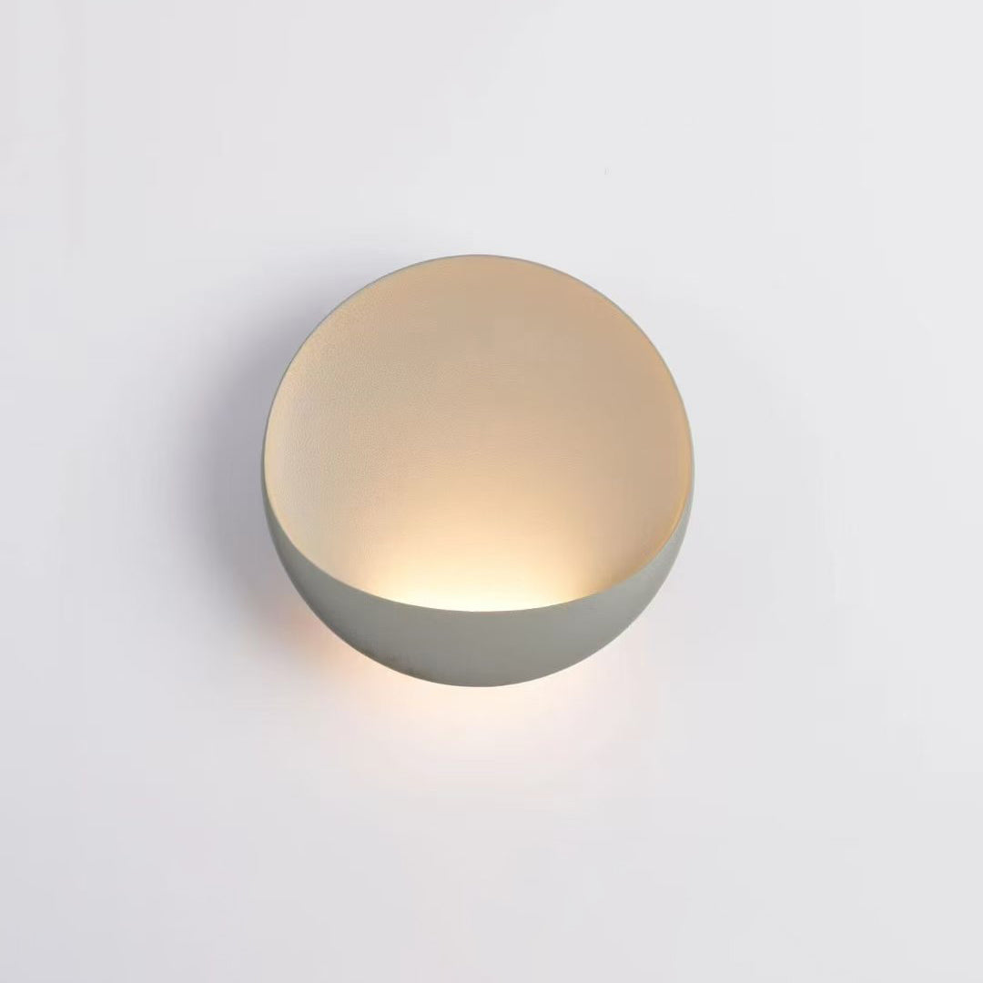 Light gray Flindt sconce in a minimalist setting.