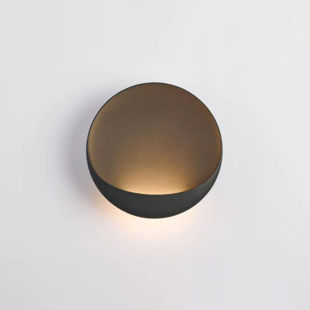Flindt Round Wall Sconce in light gray, angled view.
