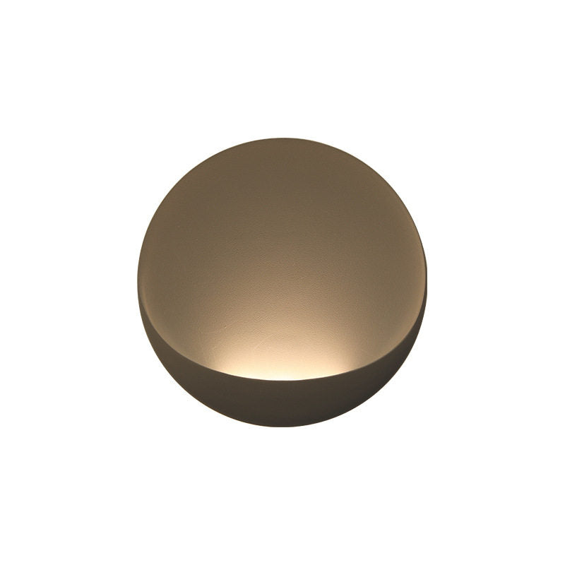 Black Flindt sconce next to a piece of modern art.