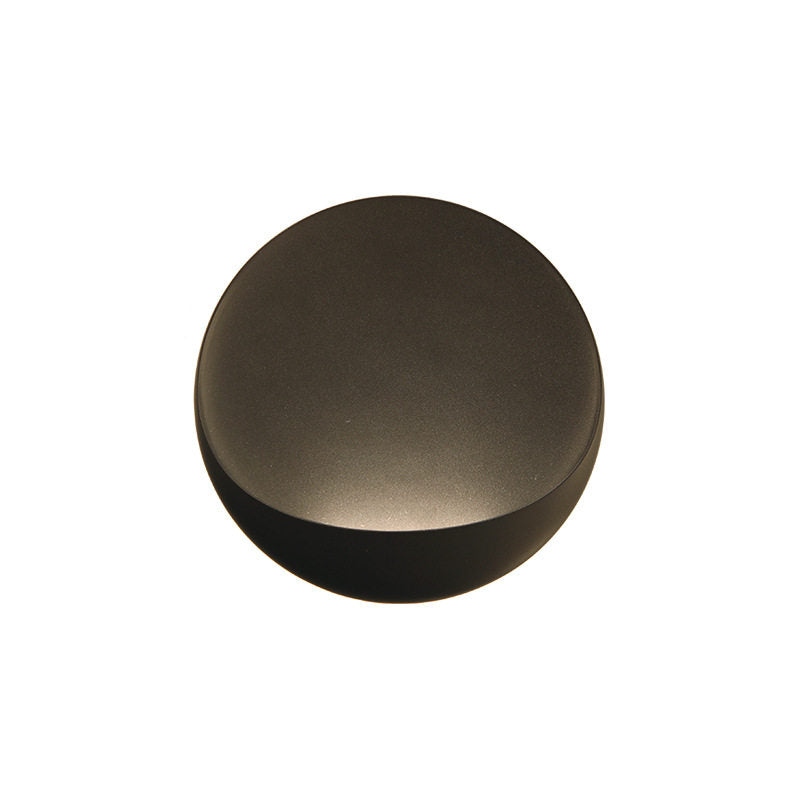 Coffee-colored Flindt sconce in a home office.
