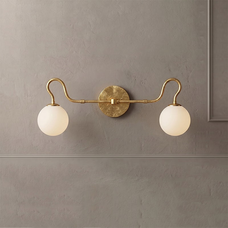 Comparison shot of the clear and white glass globe shades side-by-side.