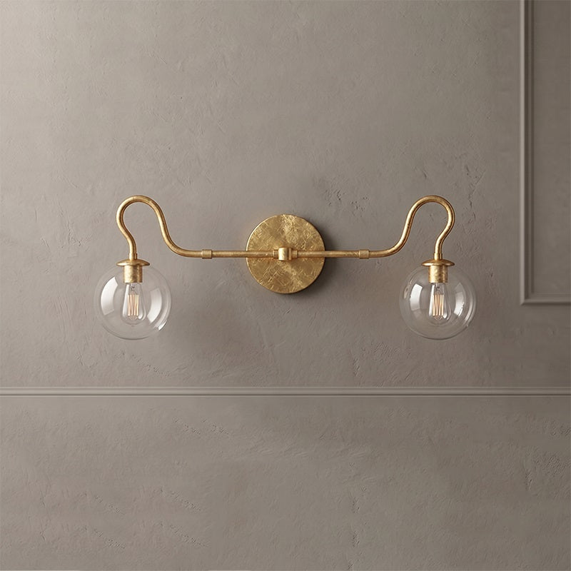 The Floren Double Wall Sconce adding a touch of elegance to a transitional living space.