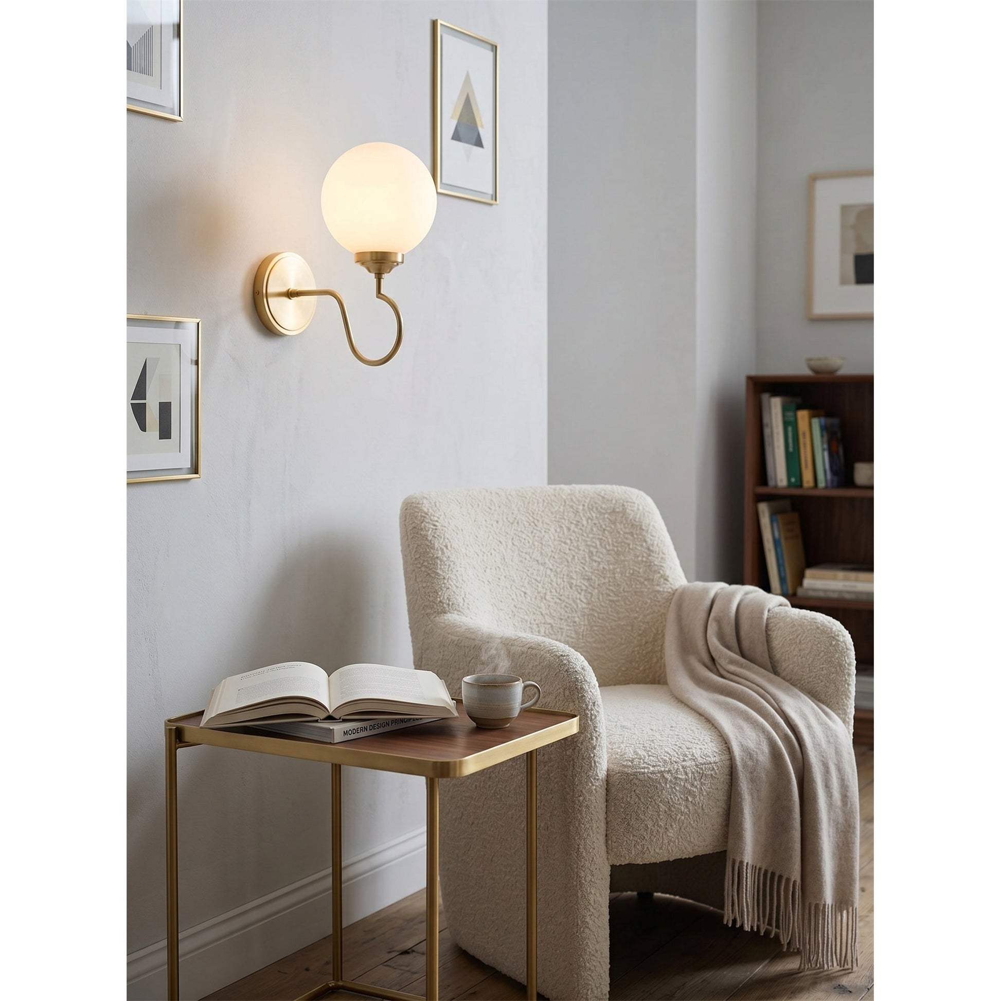 Floren Wall Sconce in black finish, installed in a modern hallway.