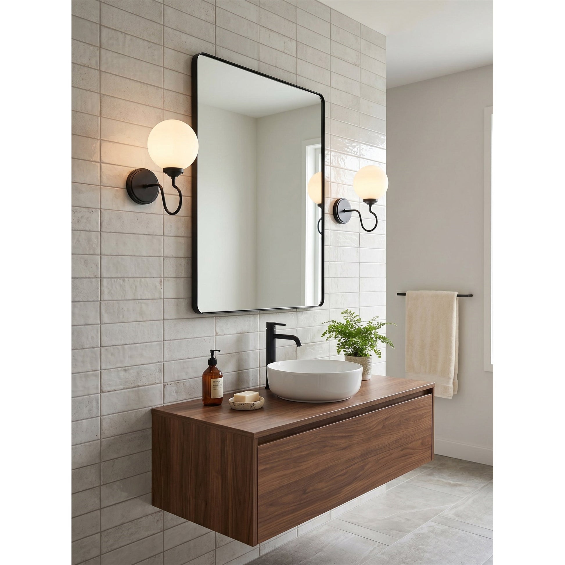 Comparison of the brass, black, and nickel finishes for the Floren Wall Sconce.