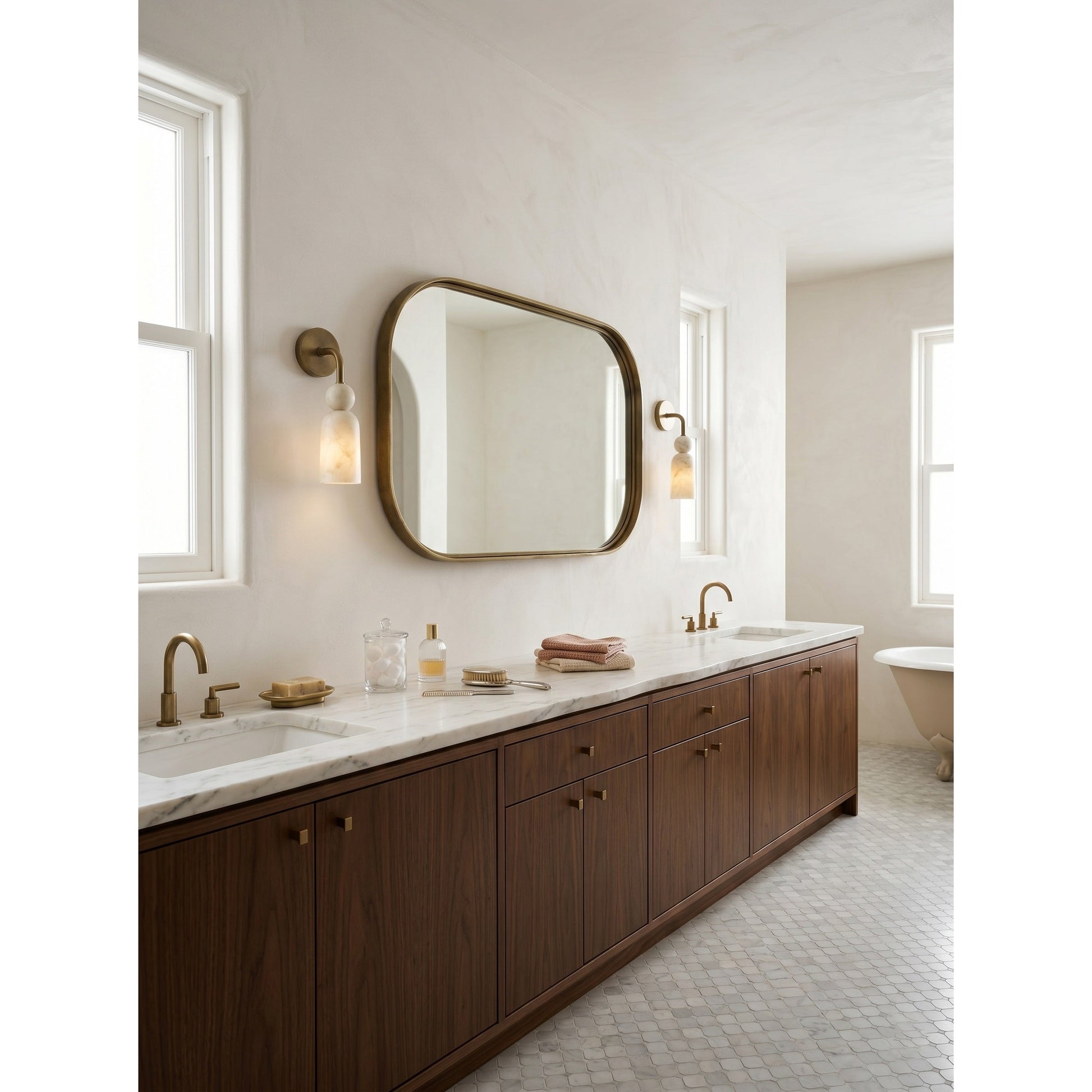 The wall sconce shown illuminated, casting a warm, serene glow.
