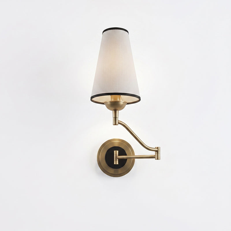 The sconce shown folded flush against the wall.