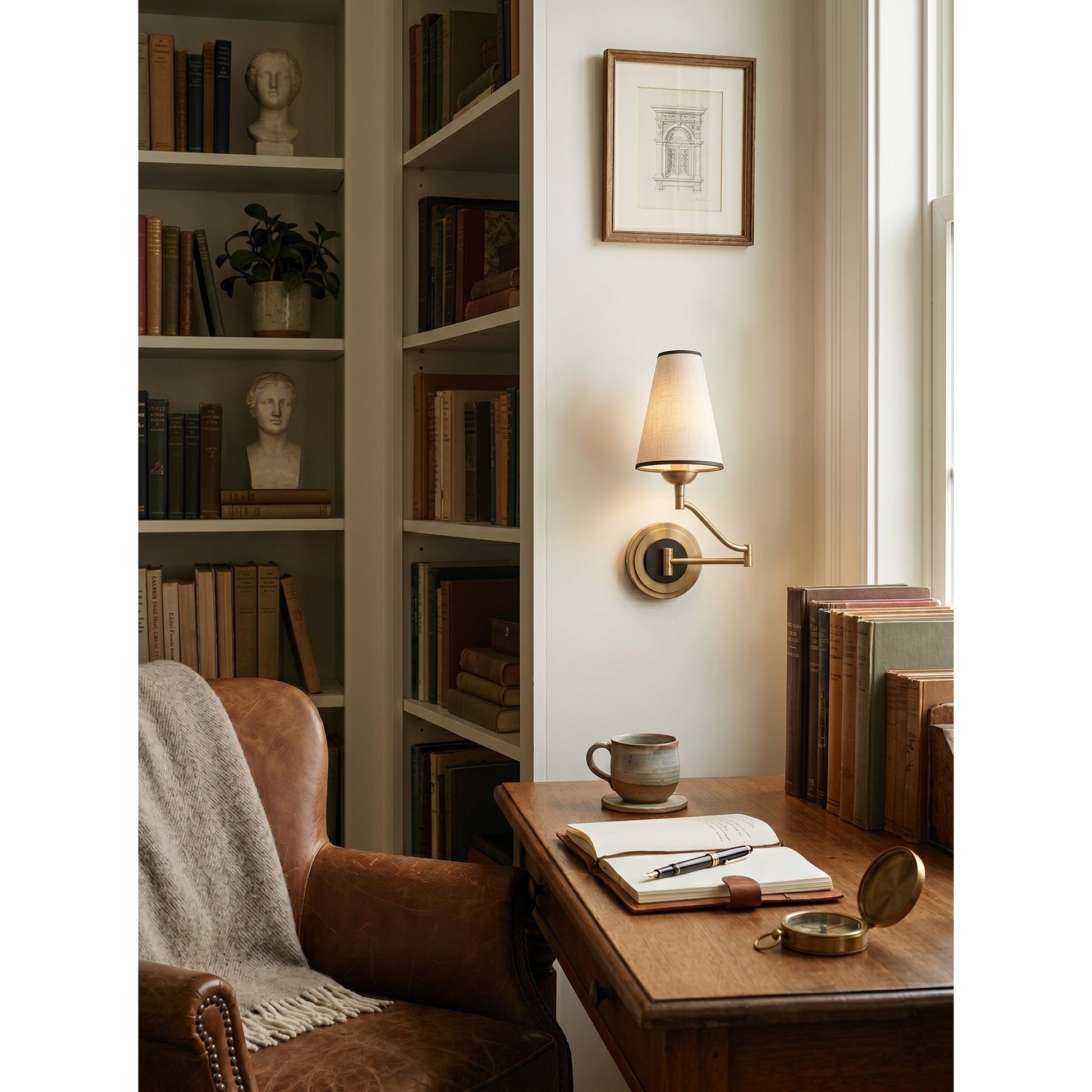 Angled view of the Fontaine Wall Sconce showing its full articulation.