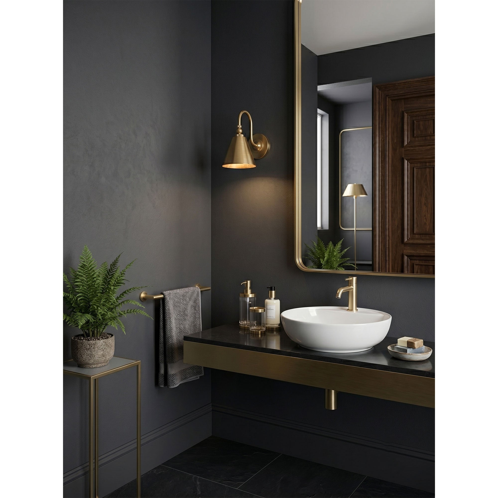 Two Forna Brass Wall Sconces installed on either side of a kitchen range hood.