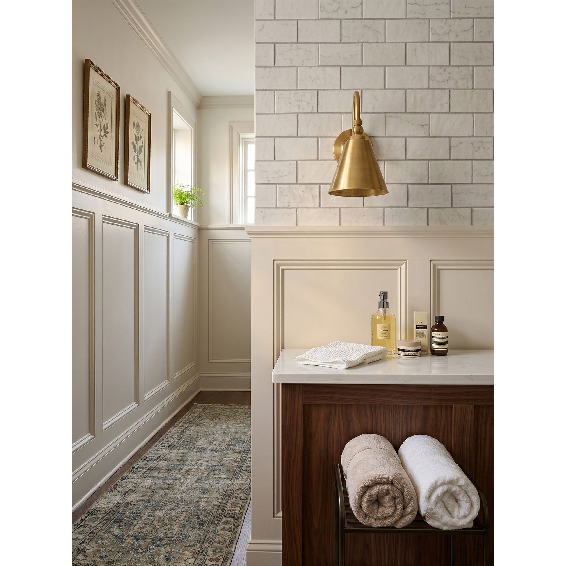 Lifestyle image showing the Forna Wall Sconce in a stylish entryway.