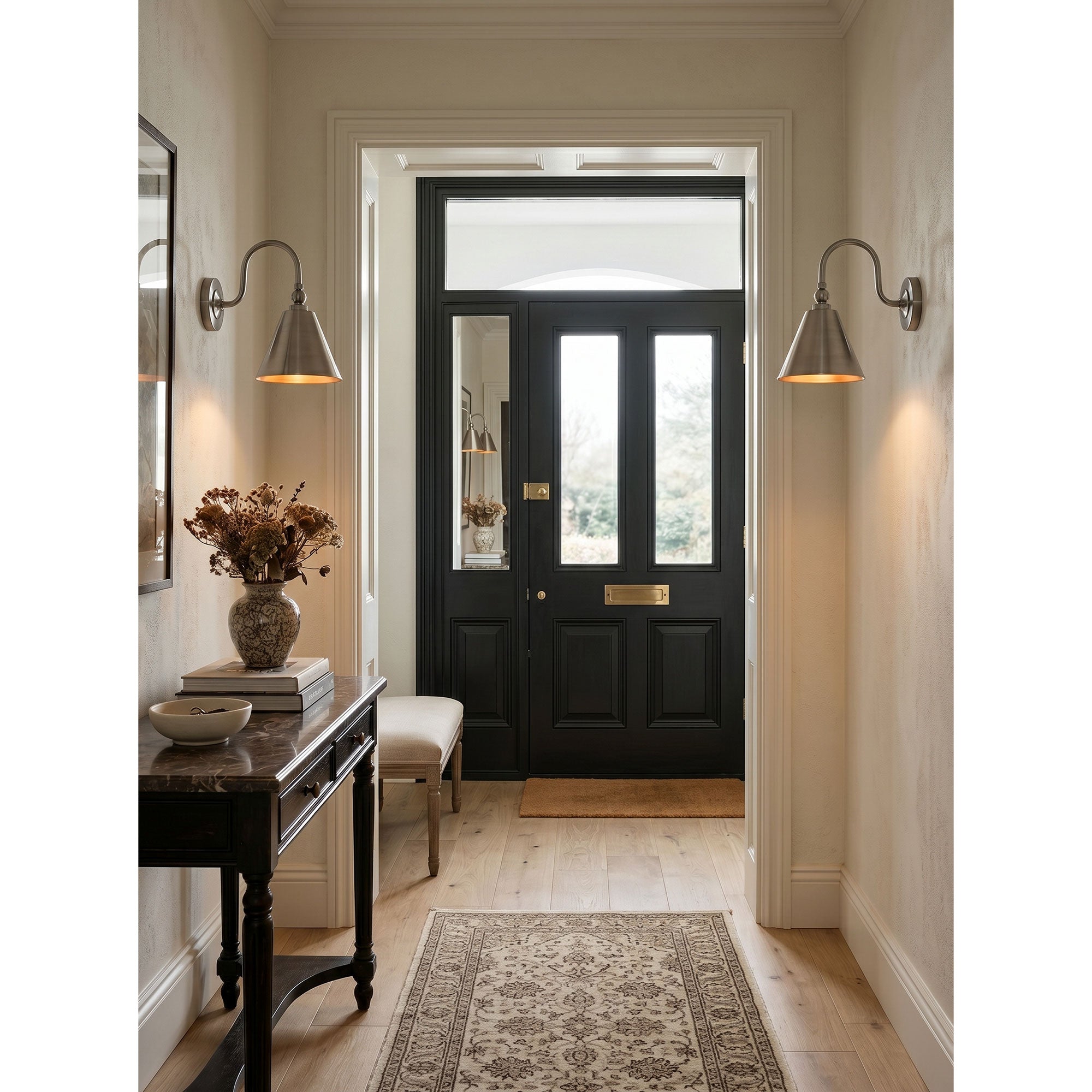 Side profile of the Forna Wall Sconce in a polished nickel finish.