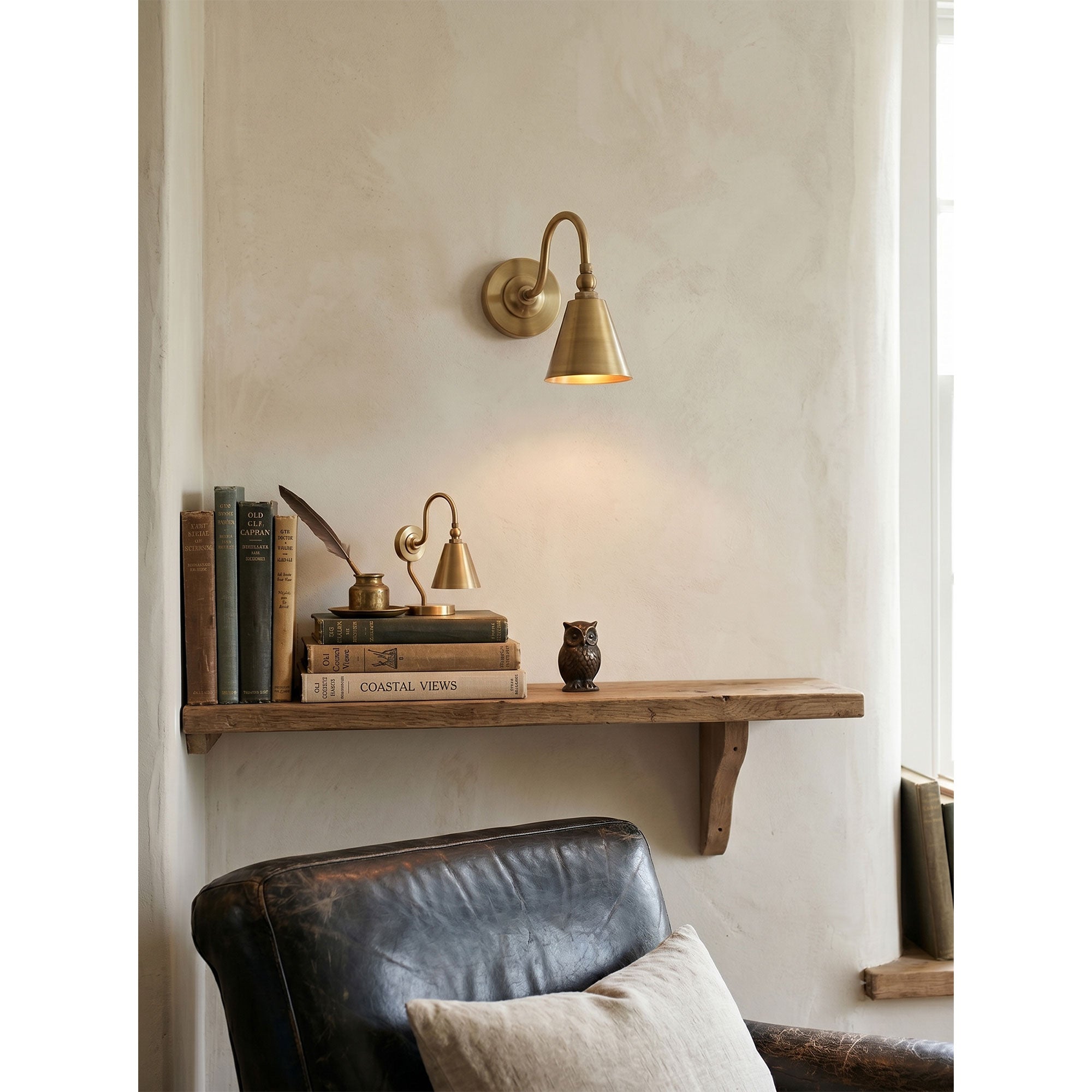 Front view of the Forna Wall Sconce in a polished nickel finish.