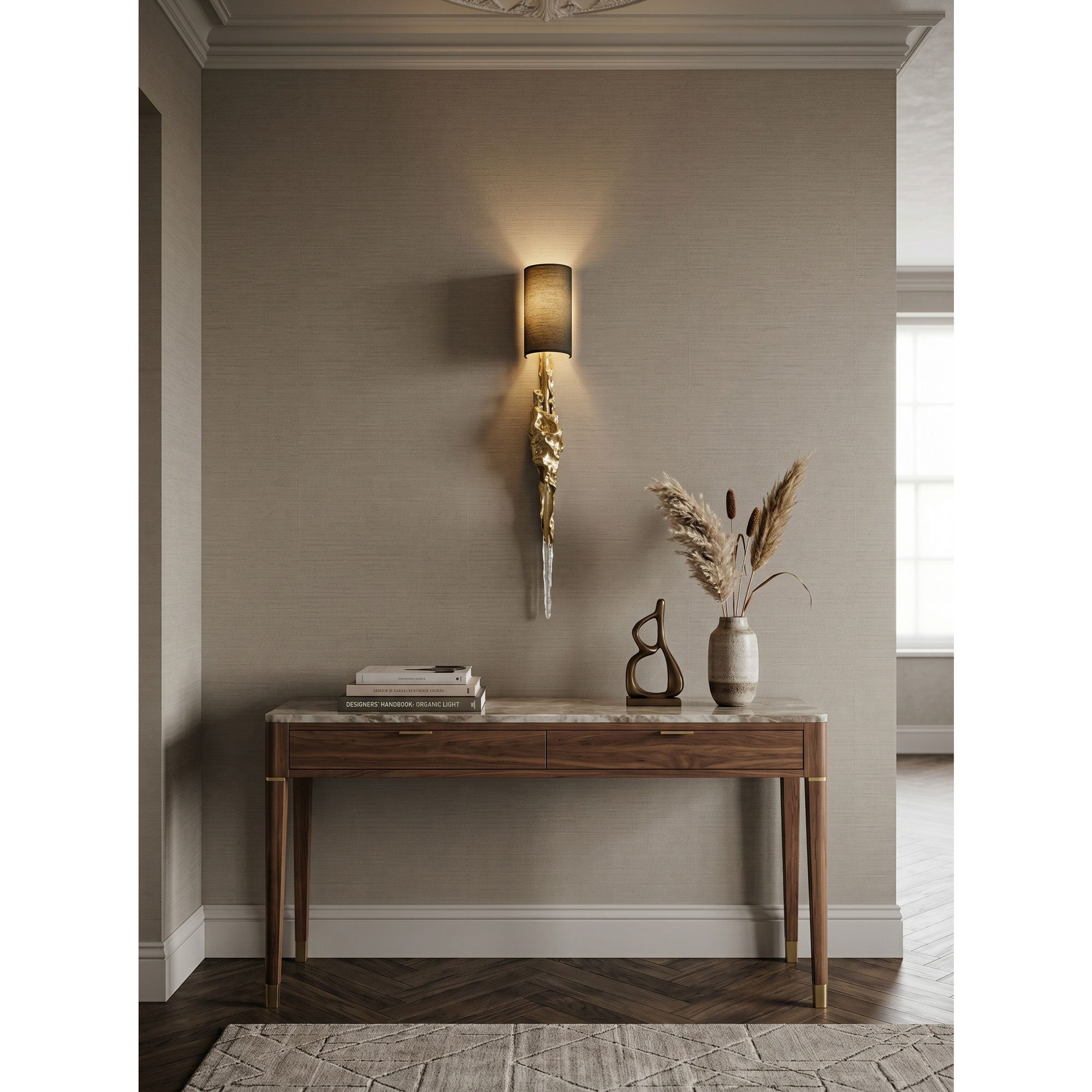 The artistic fusion of brass, crystal, and fabric materials in the sconce design.