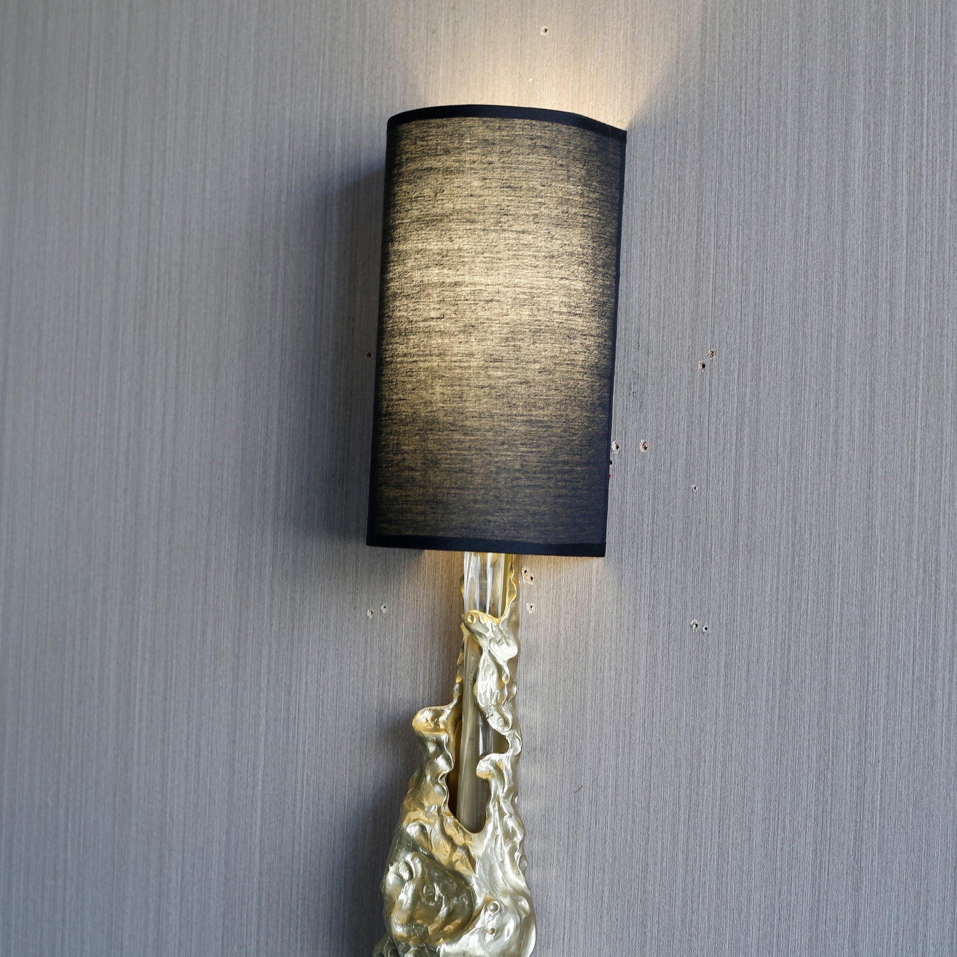 The backplate and hardwiring components included with the Fusion Wall Sconce.