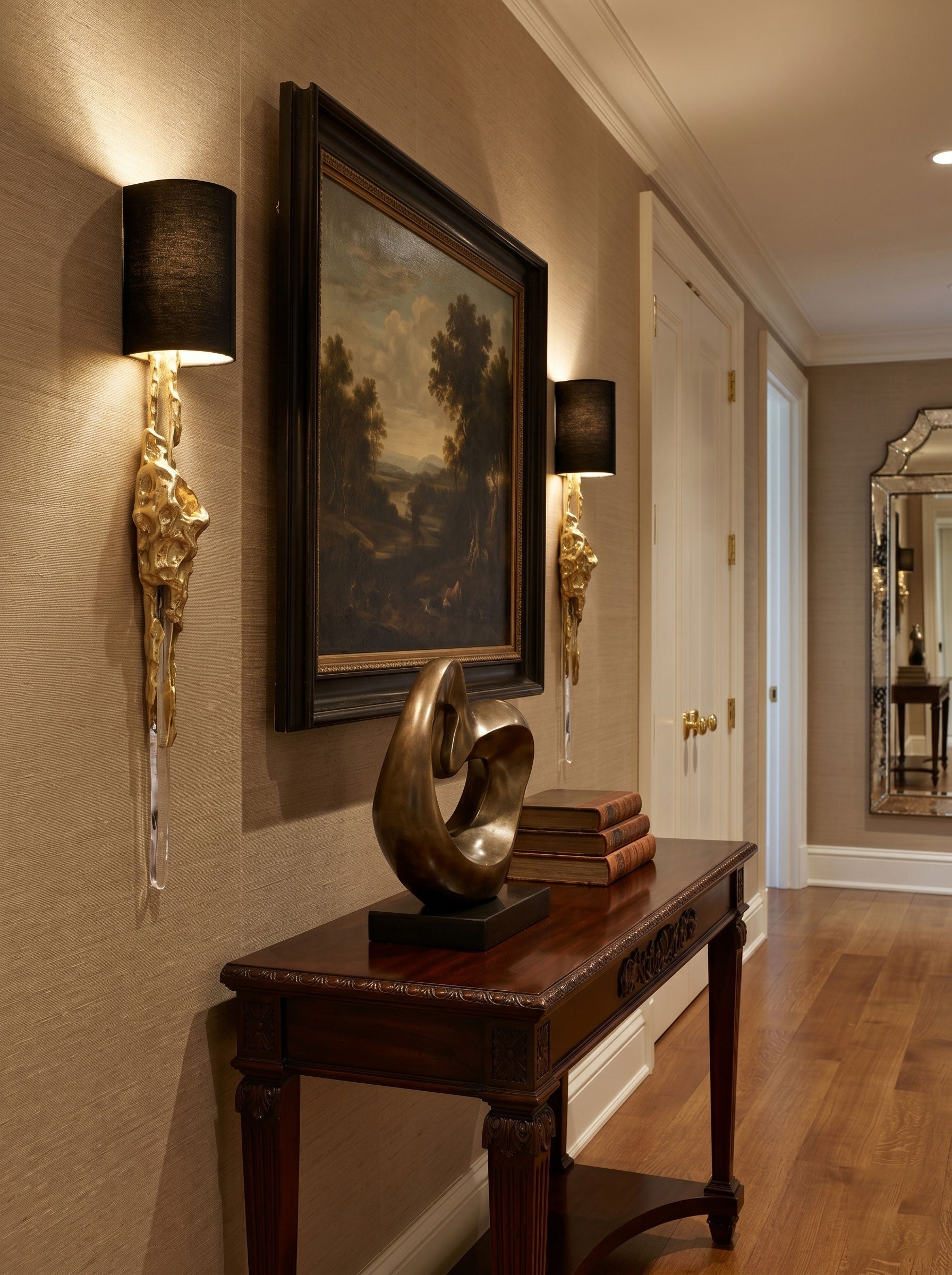 Angled view of the Fusion Wall Sconce, highlighting its sculptural form and crystal spike.