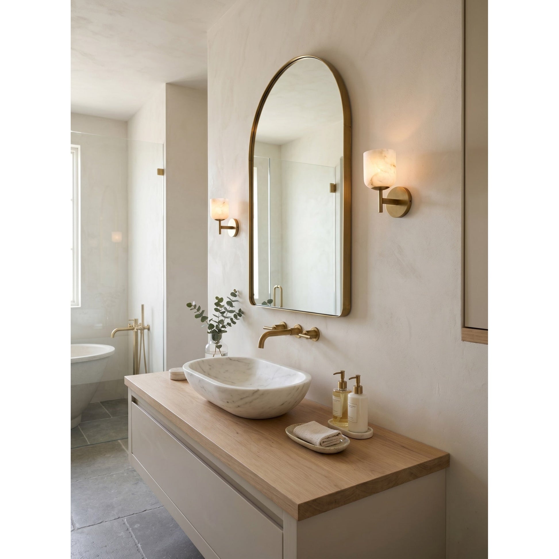 Lifestyle image of the double-head sconce in a hallway.