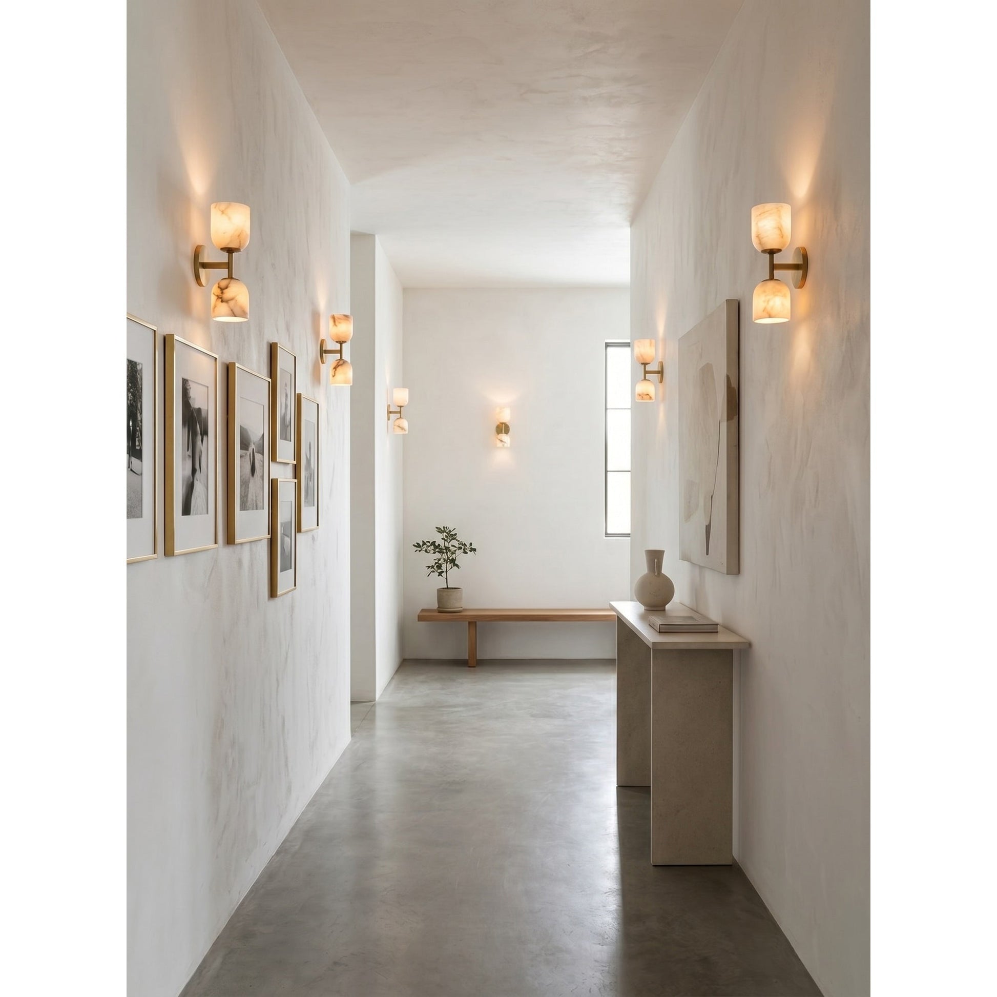 A pair of Garrison Wall Sconces flanking a fireplace mantel.