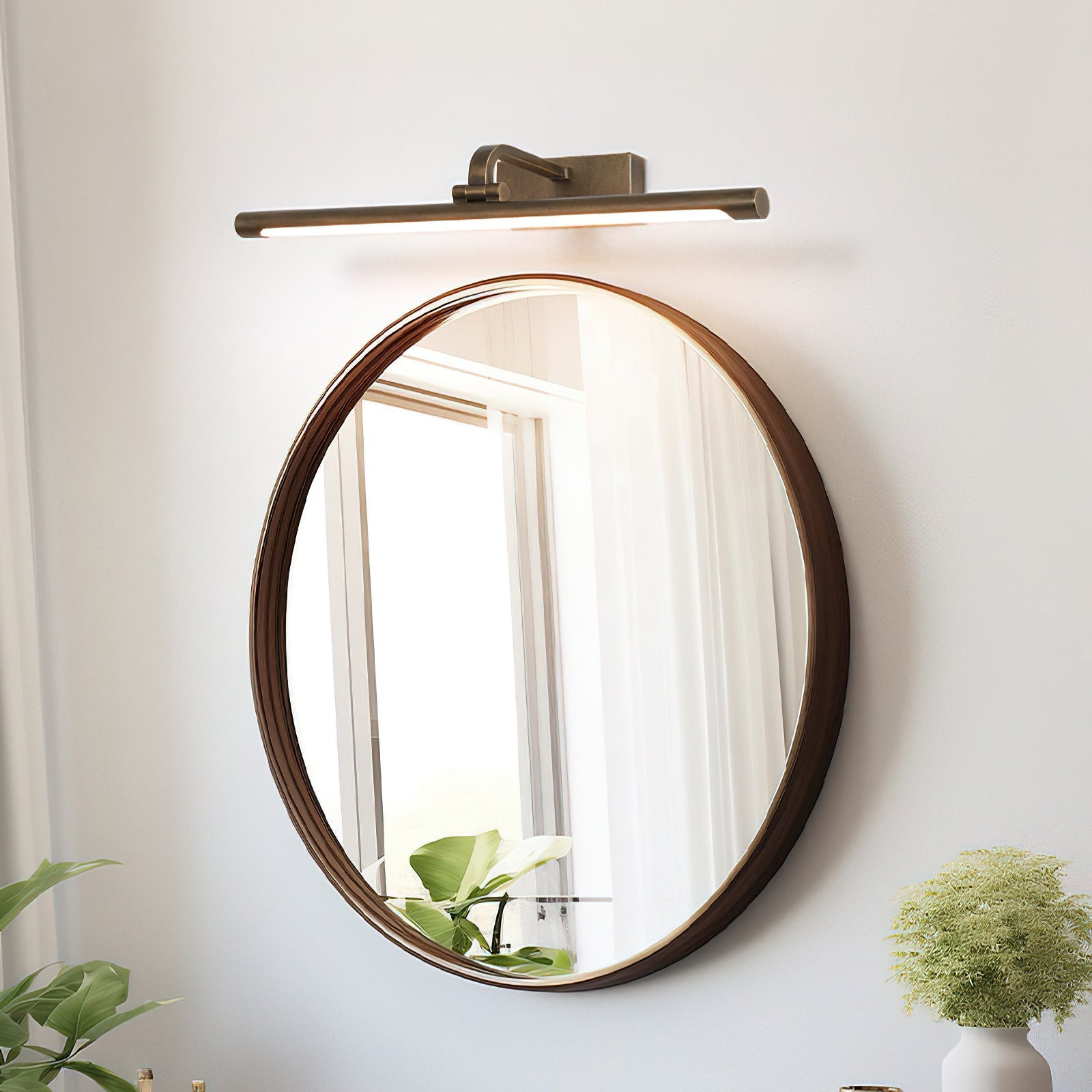 Front view of the Goya Brass Wall Sconce against a neutral wall.
