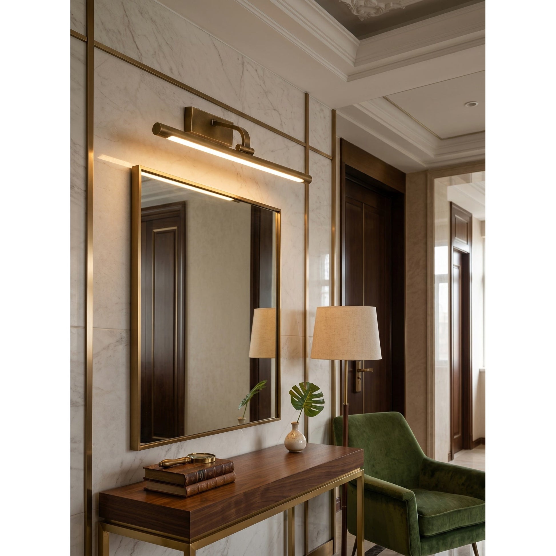 Lifestyle image of the Goya sconce installed over a bookshelf.