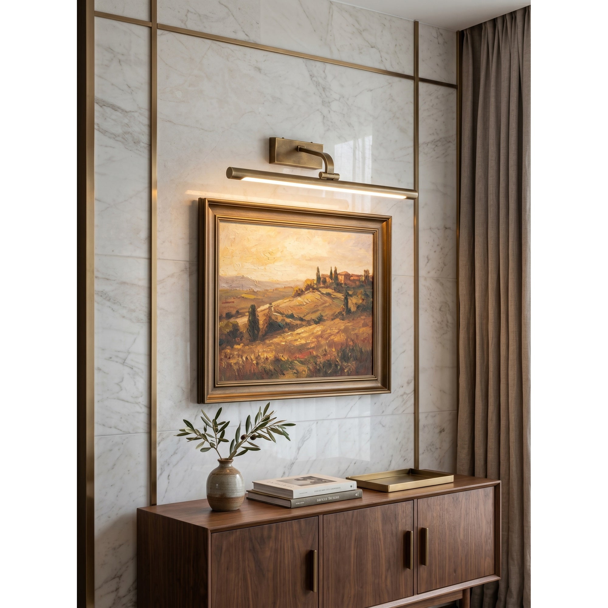 Goya Brass Wall Sconce mounted on a light-colored wall.
