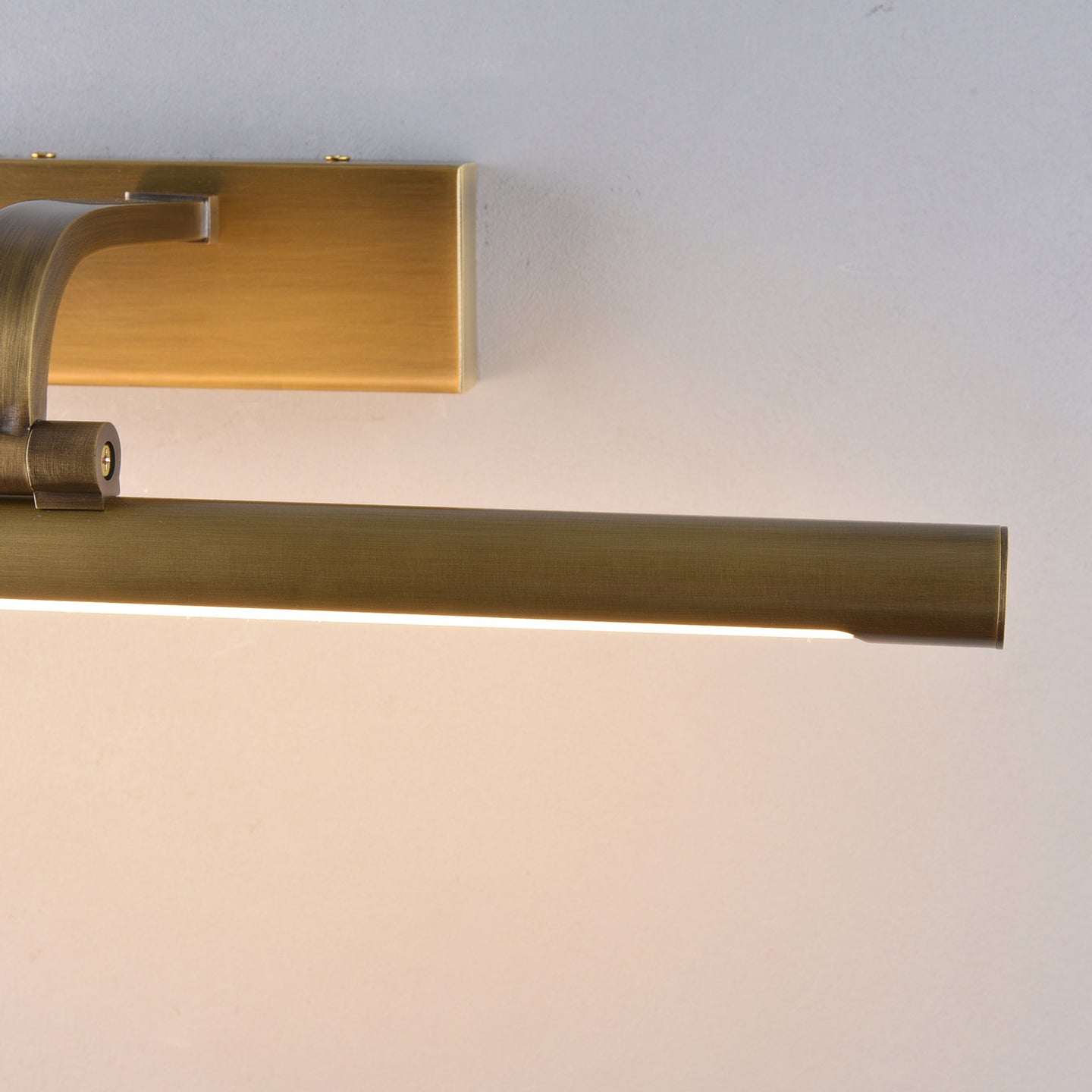 Another view of the Goya sconce illuminating a piece of abstract art.