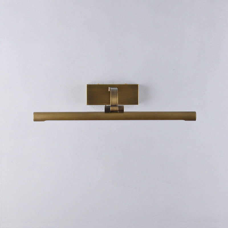 Goya sconce illuminating a multi-piece gallery wall.