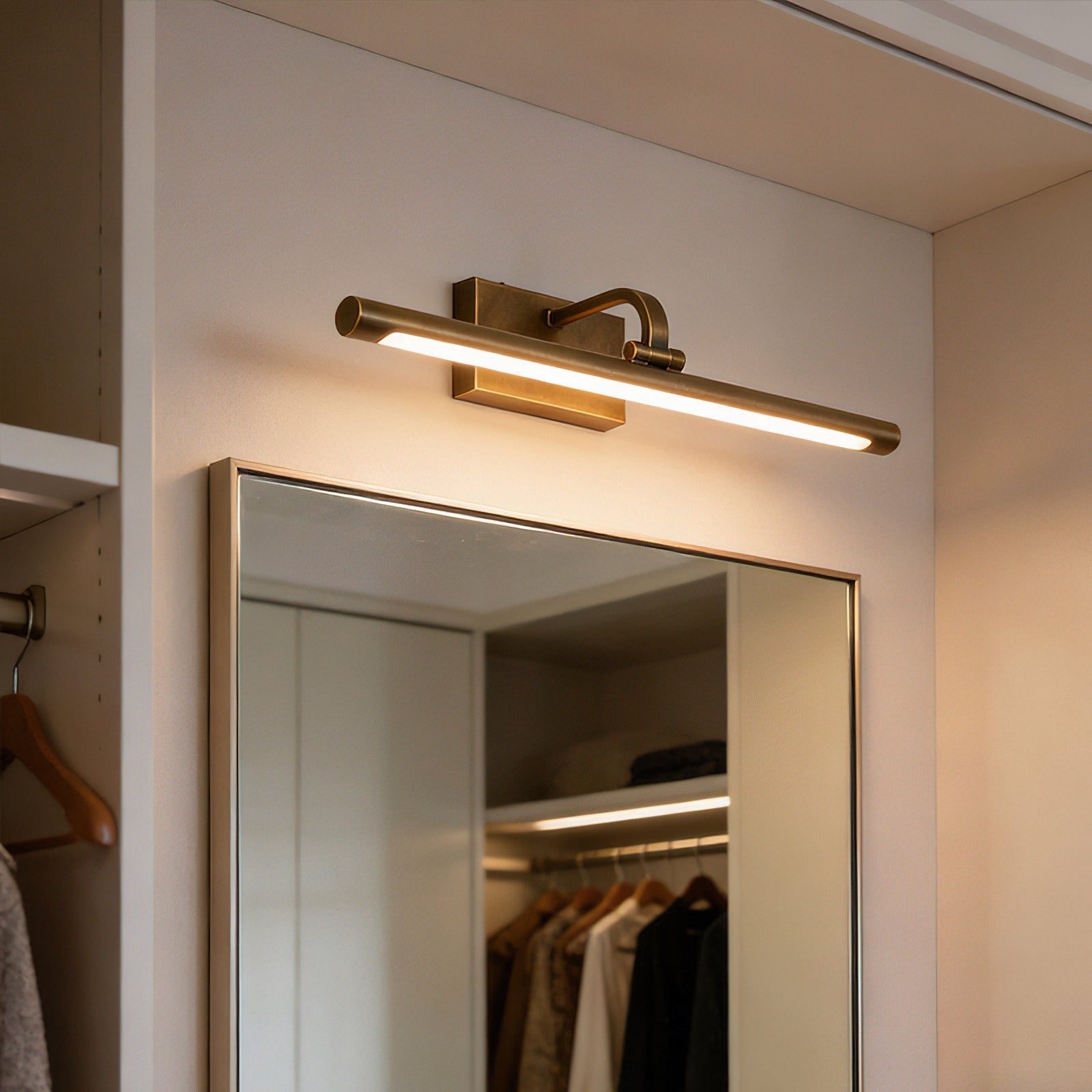 Goya Brass Wall Sconce shown in a mid-century modern setting.