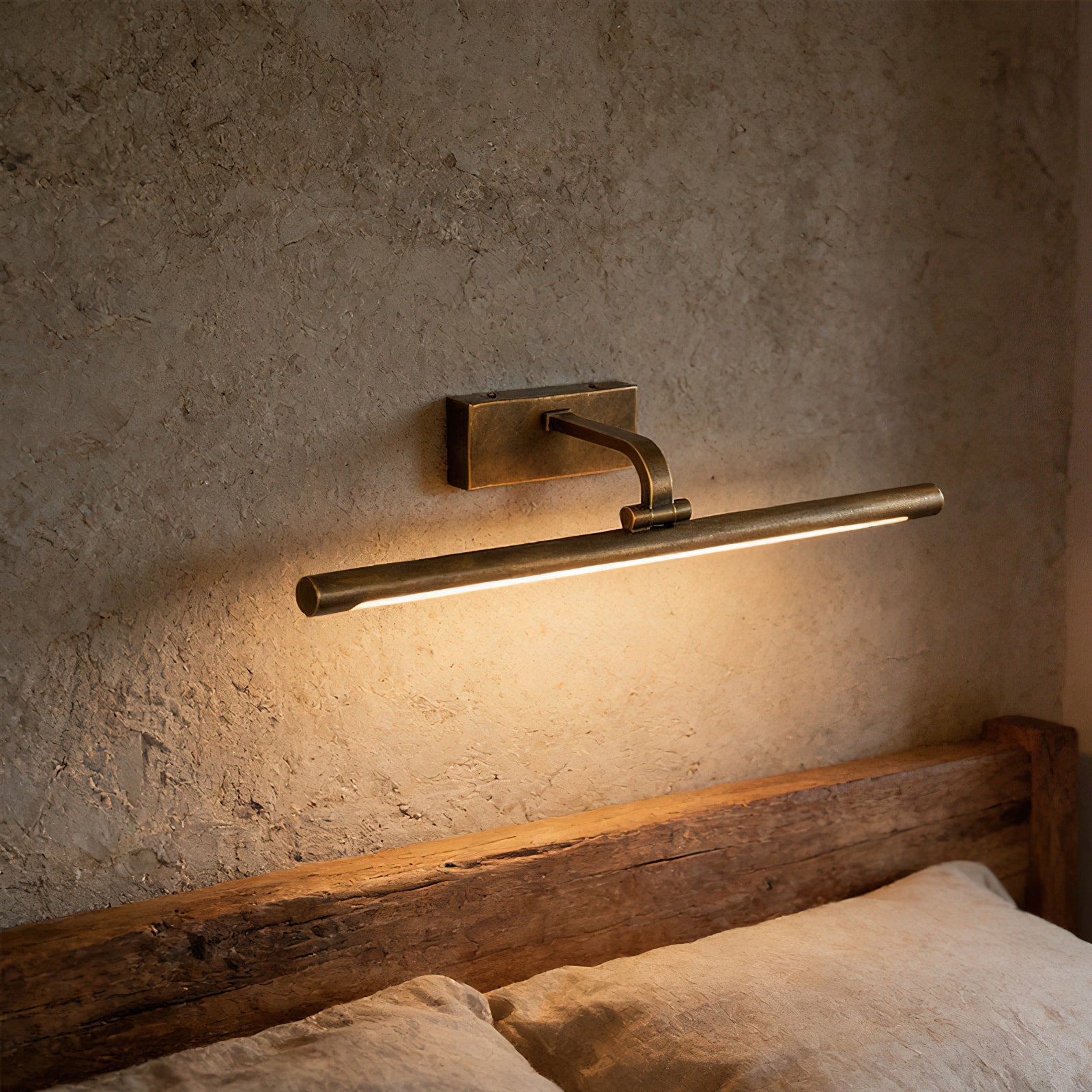 Side view of the Goya Brass Wall Sconce showing its profile.