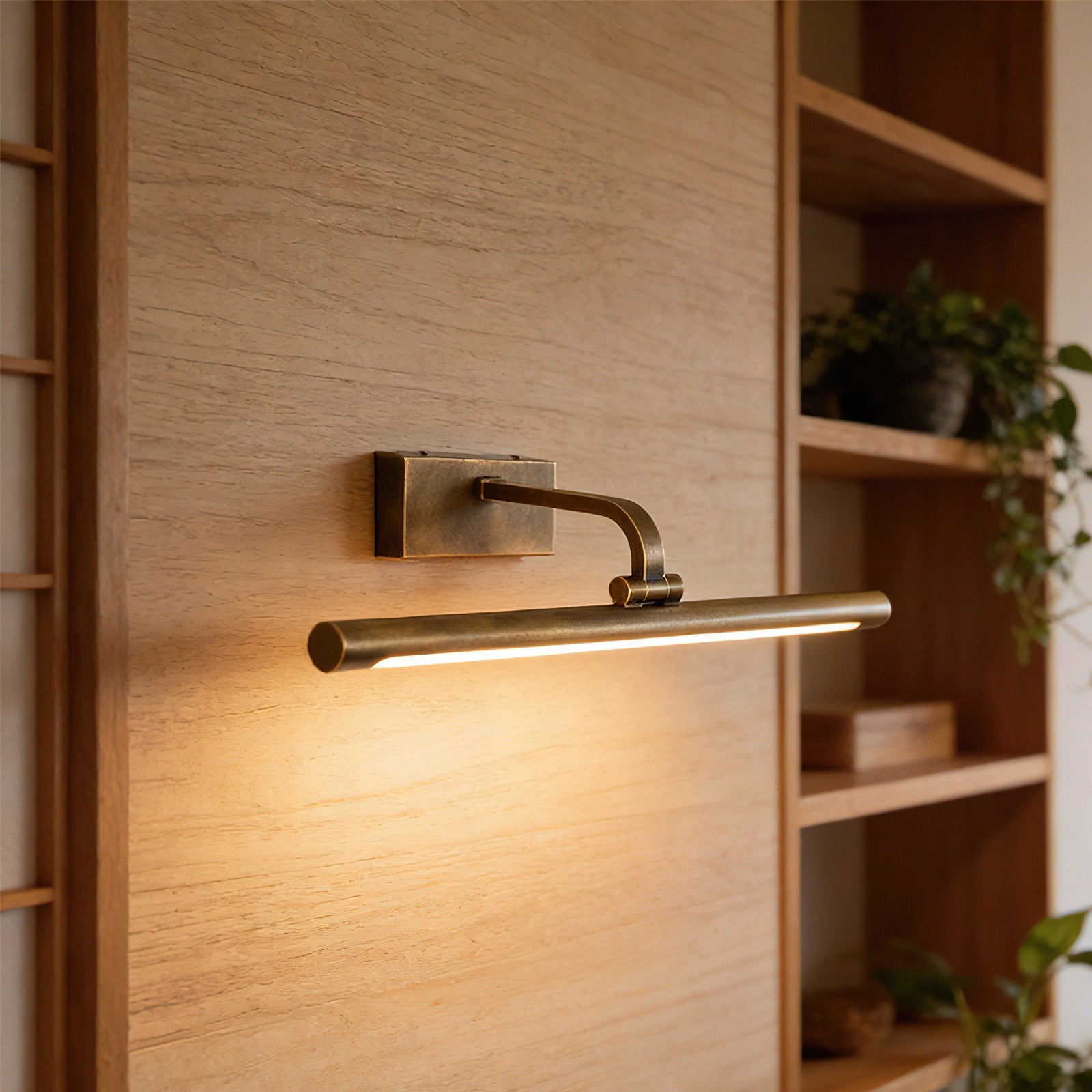 Close-up of the Goya Brass Wall Sconce's adjustable arm.