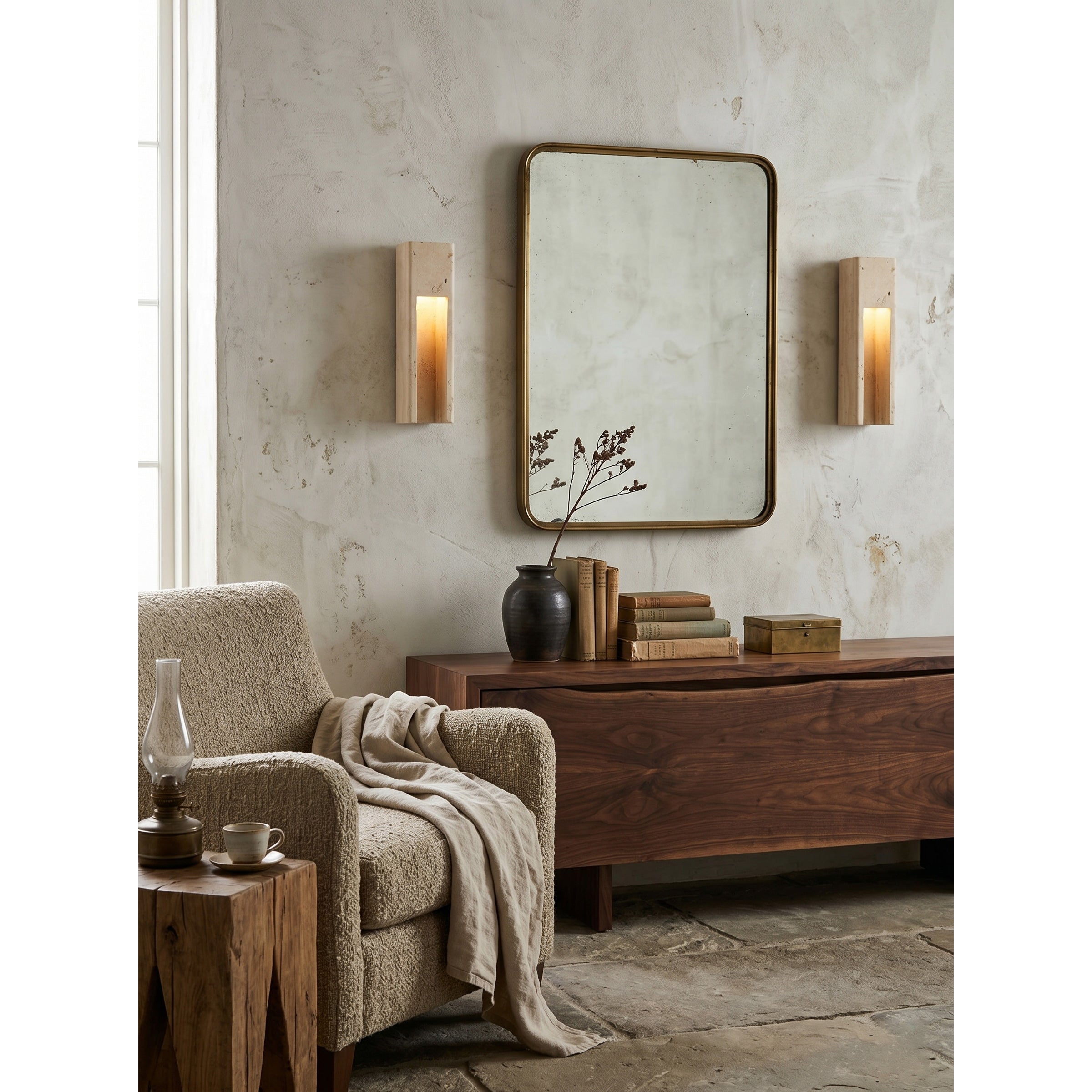 Detail shot of the recessed niche and light source of the travertine sconce.