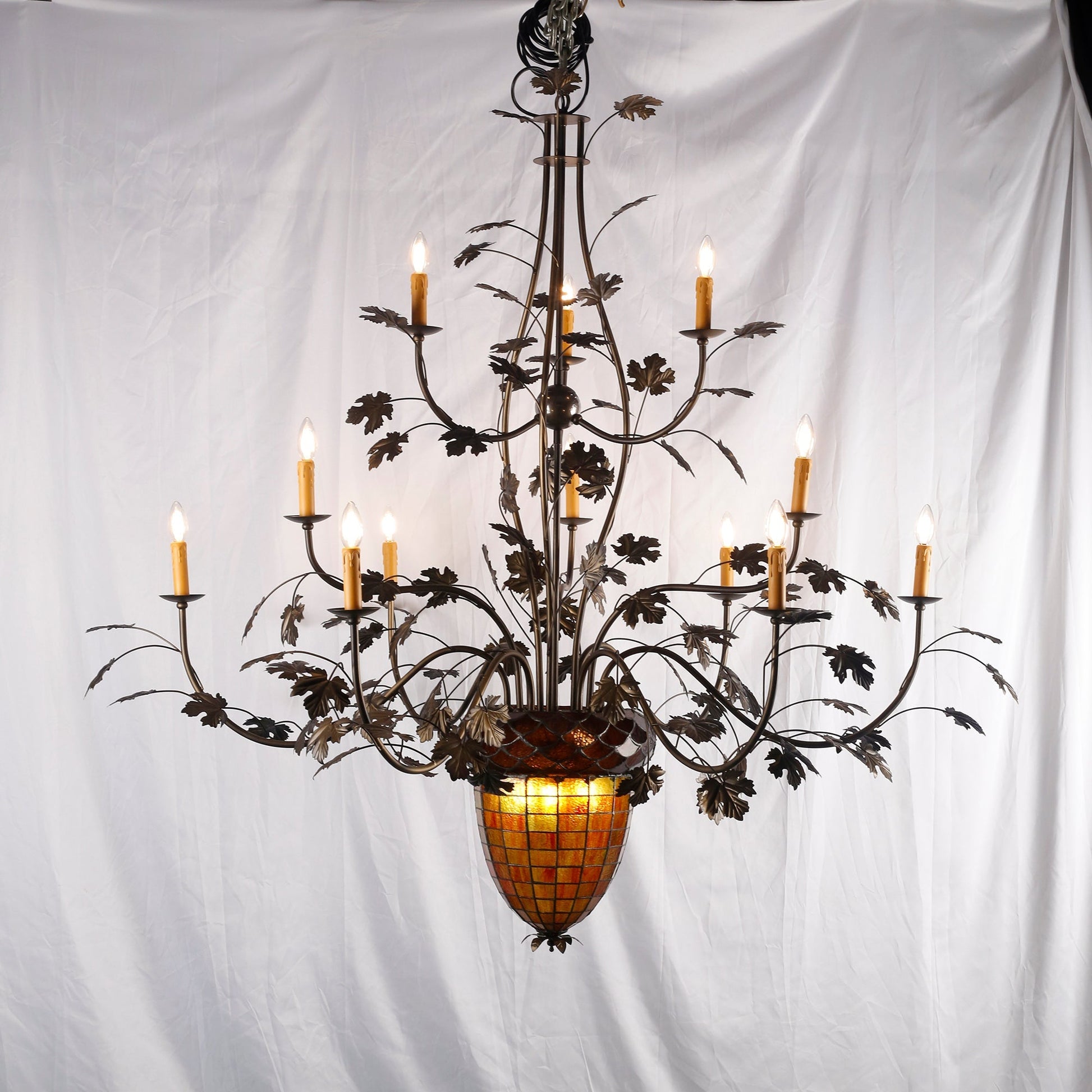 The chandelier with lights on, casting a warm glow.