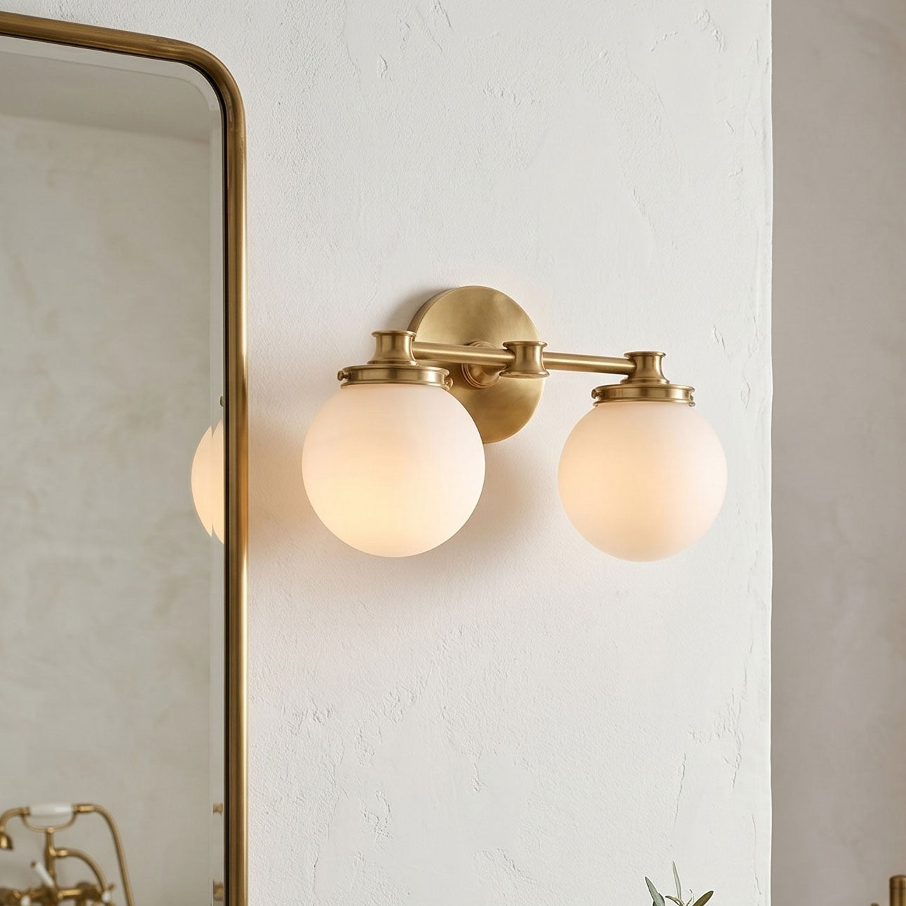 Close-up of the frosted glass globe shade on the Hayes Wall Sconce.