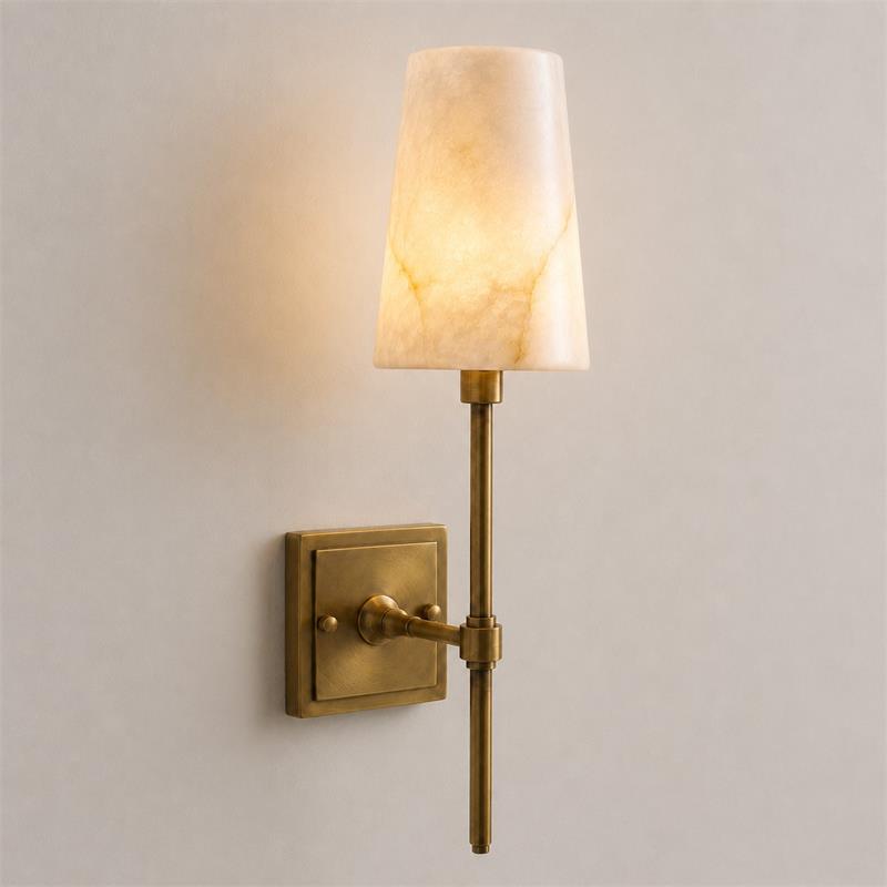 The sconce shown in a bathroom setting, adding a touch of luxury.