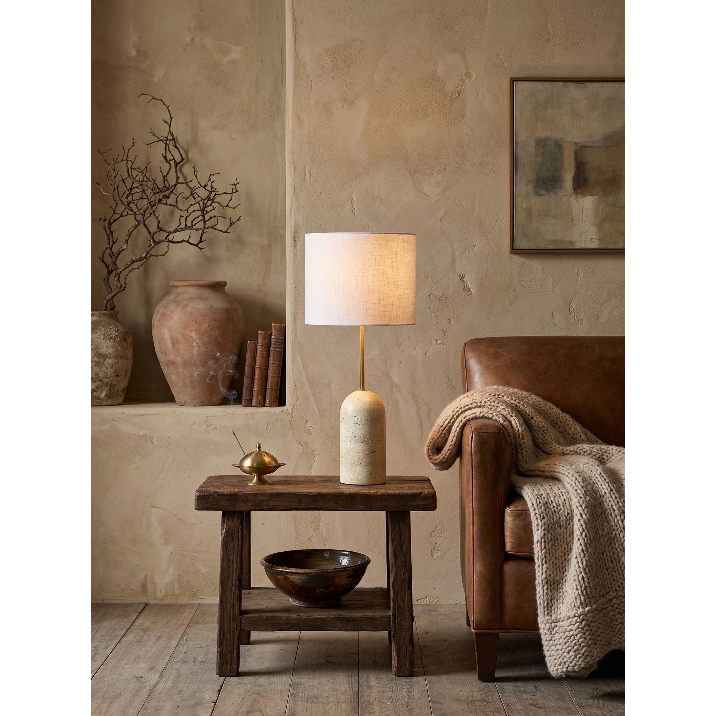 Full view of the pill-shaped solid travertine stone base.