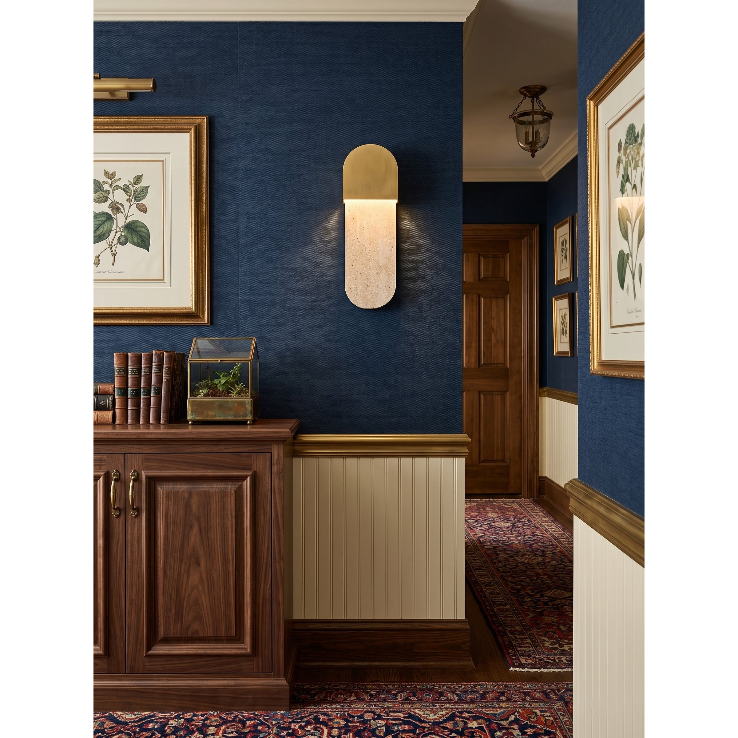 A pair of Hudson Wall Sconces used as vanity lights flanking a bathroom mirror.