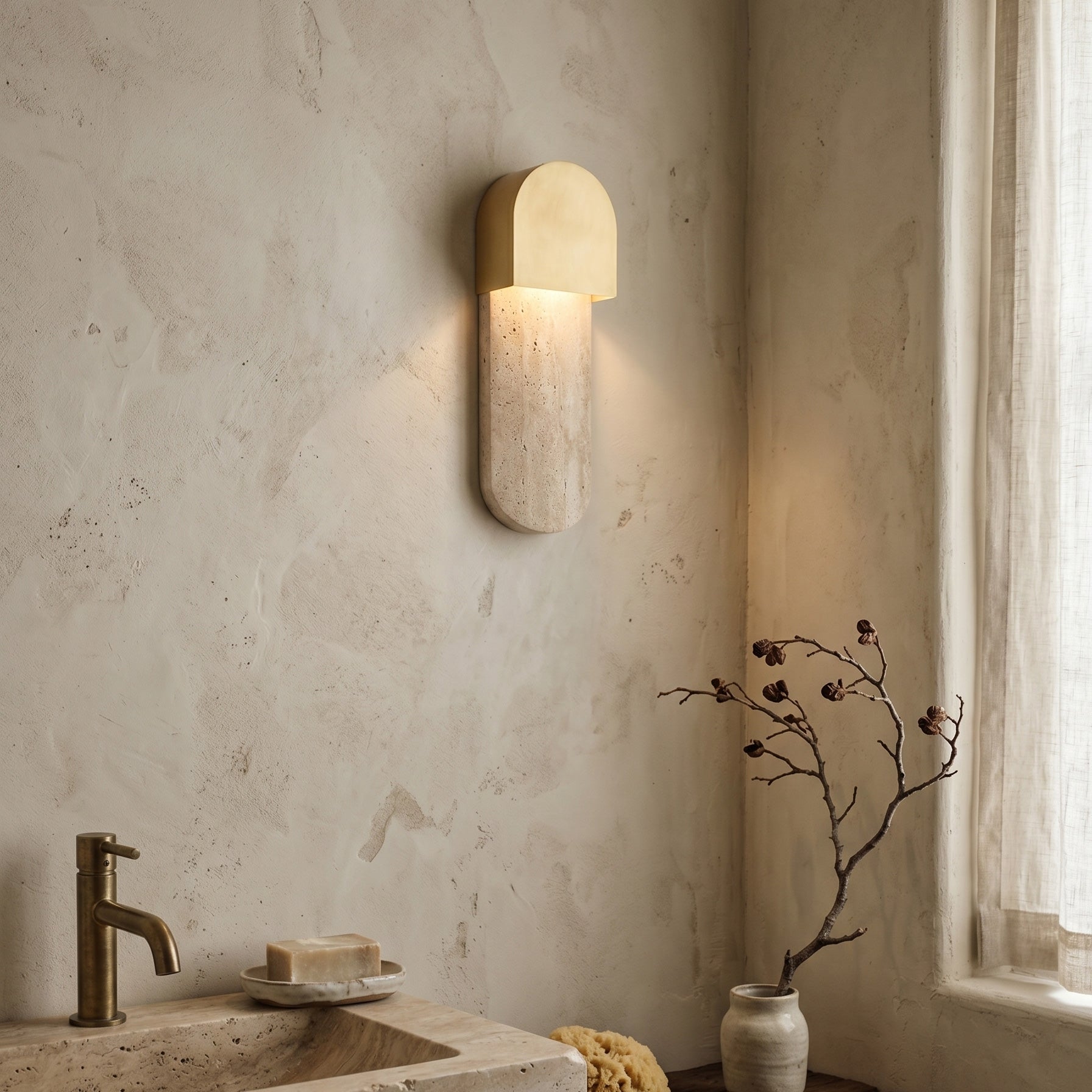 Angled view of the modern Hudson Wall Sconce against a neutral wall.