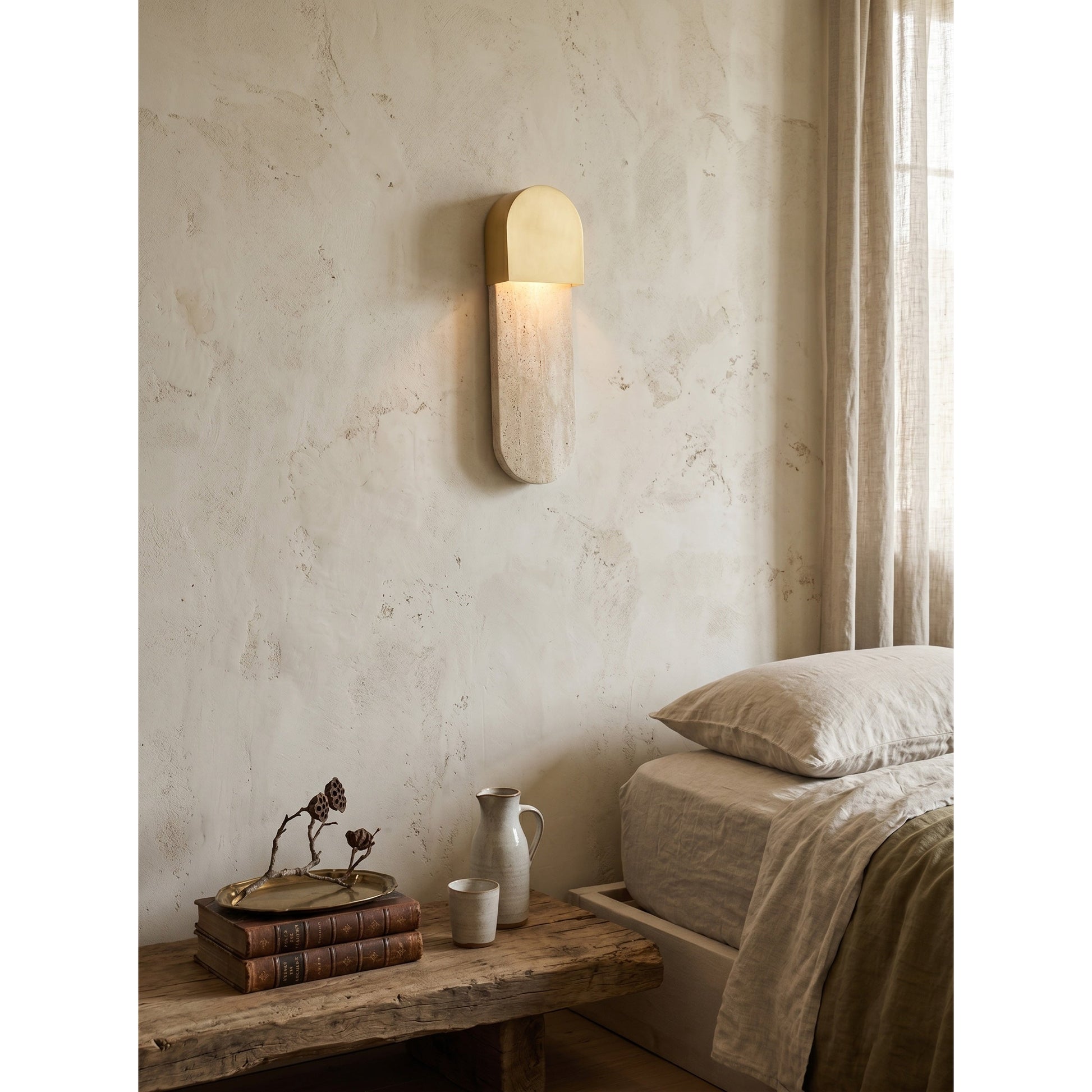 The Hudson Wall Sconce illuminated, casting a soft, warm downward glow.