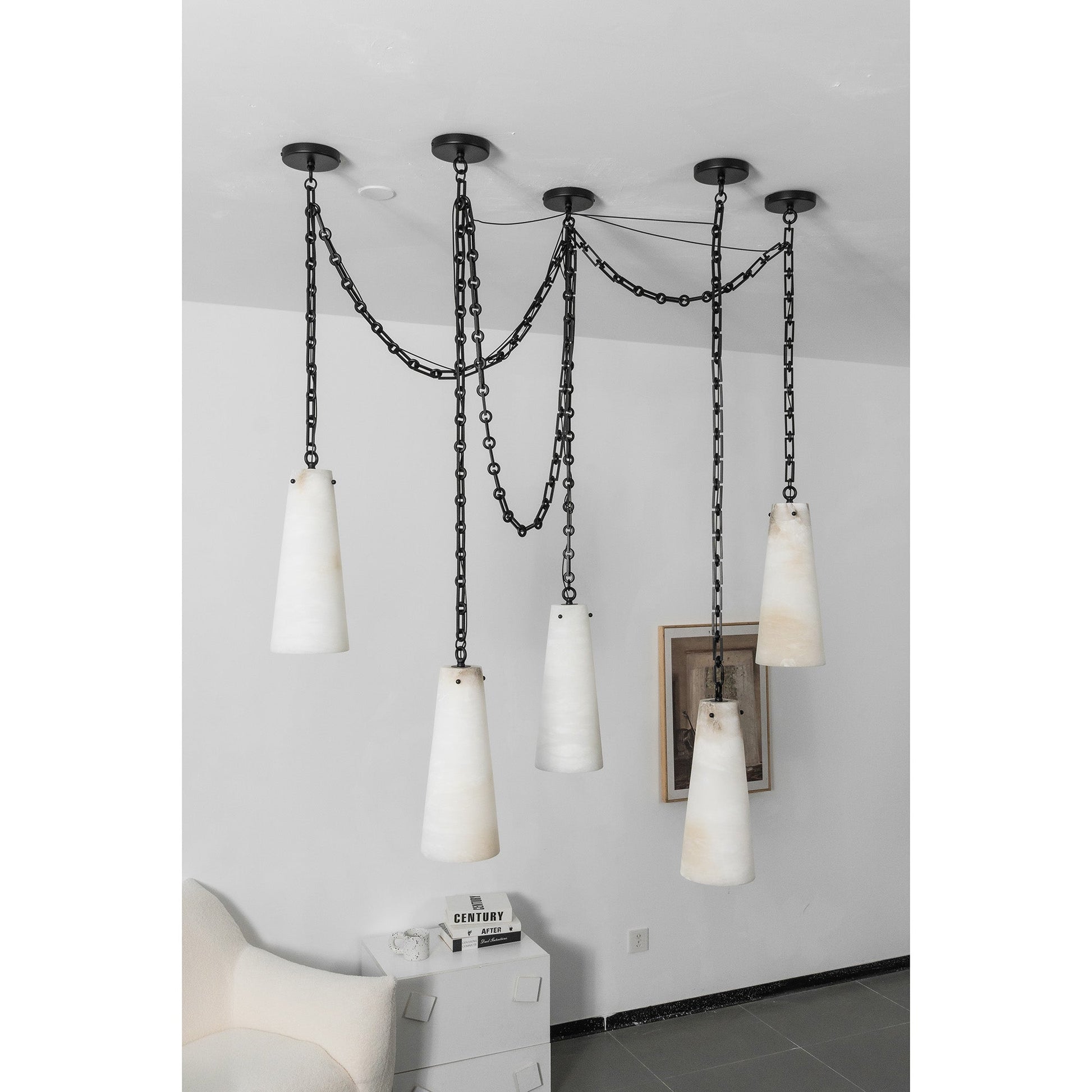 The chandelier turned on, highlighting the warm light diffusion through alabaster.