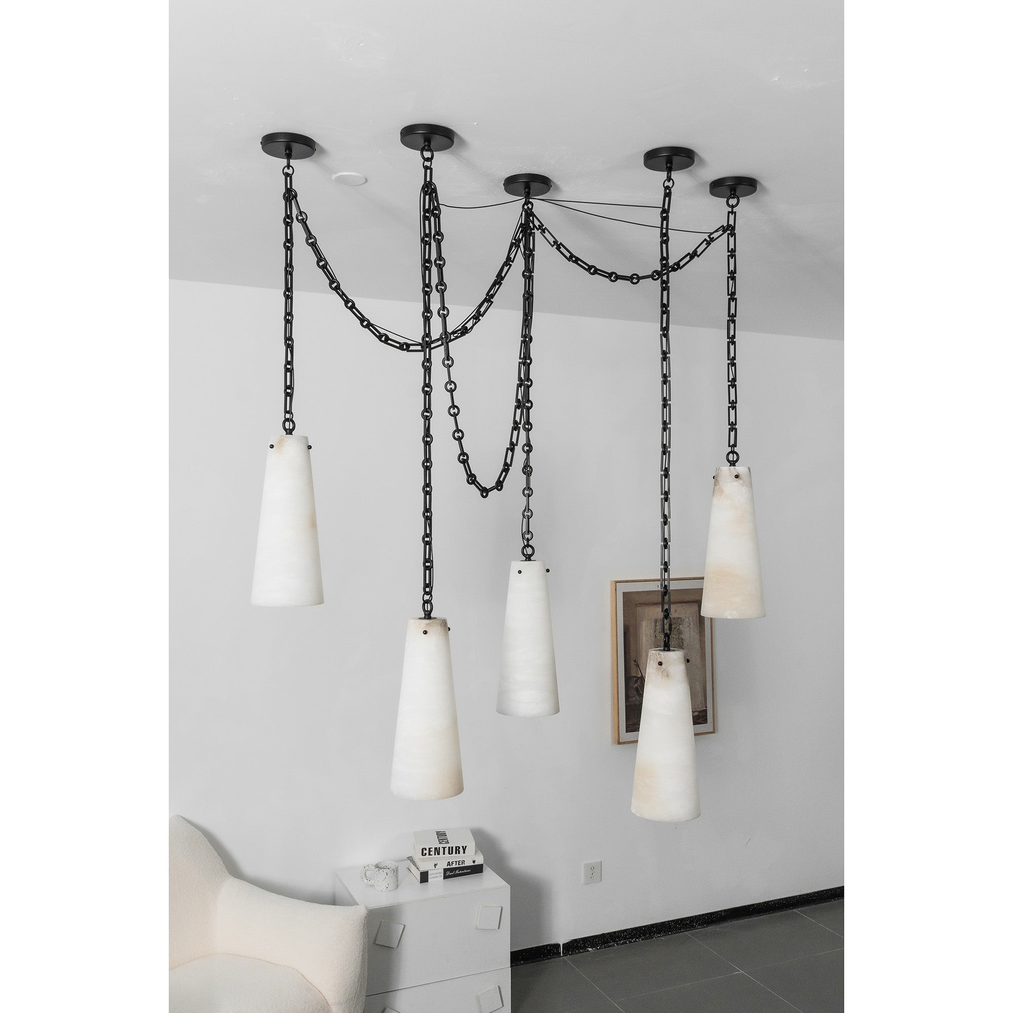 The chandelier turned on, highlighting the warm light diffusion through alabaster.