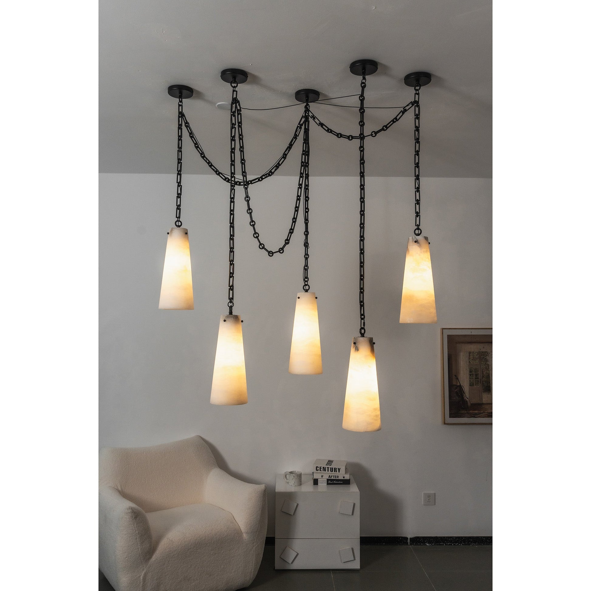 The chandelier as a centerpiece in a minimalist interior.