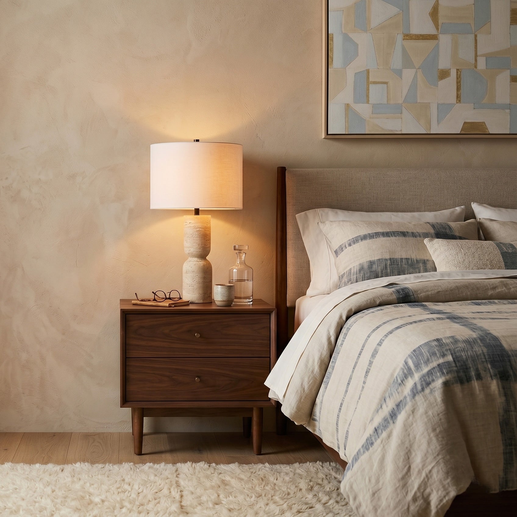 The lamp on a bedroom nightstand, creating a serene ambiance.
