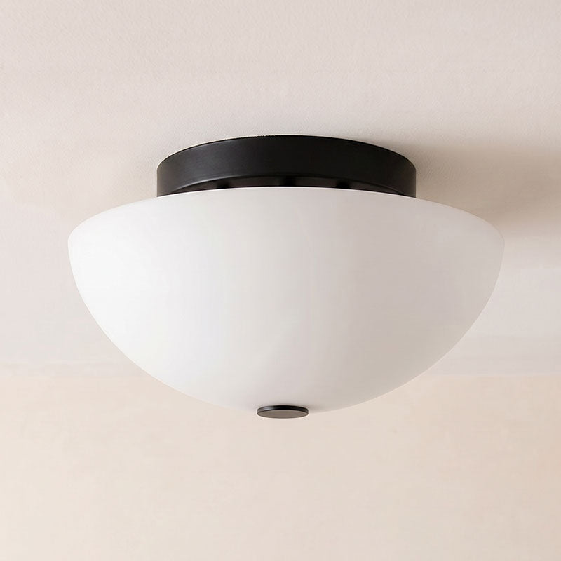 Jeanne flush mount in black installed in a contemporary room.