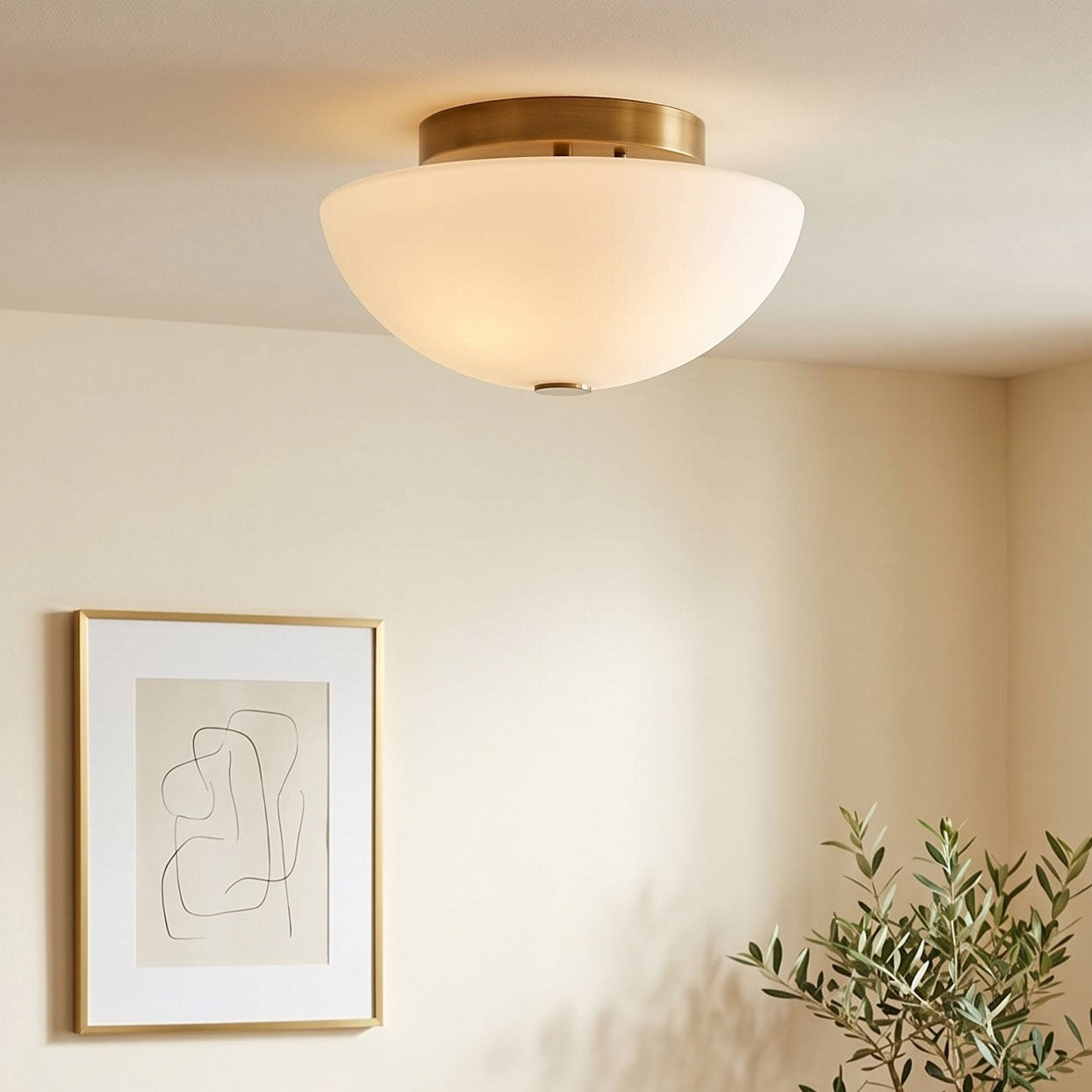 Angled view of the Jeanne flush mount showing the white glass shade.