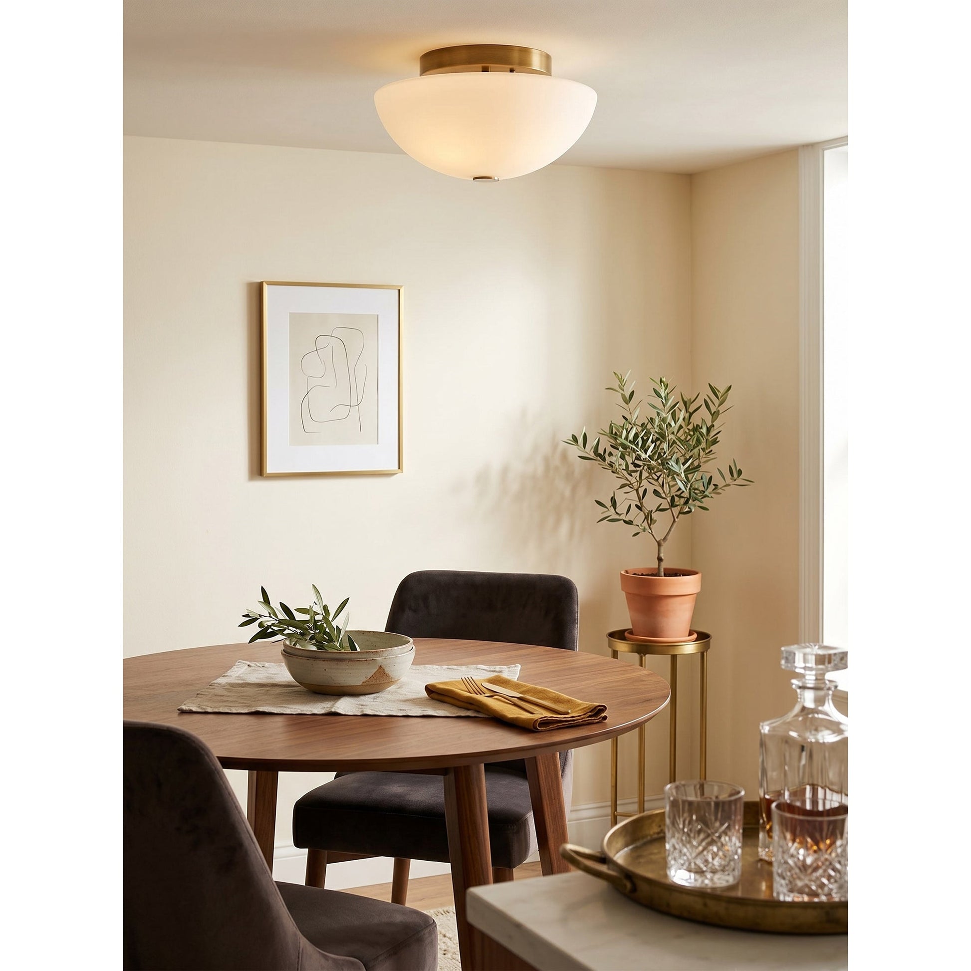 Jeanne flush mount light turned on, casting a soft, warm glow.