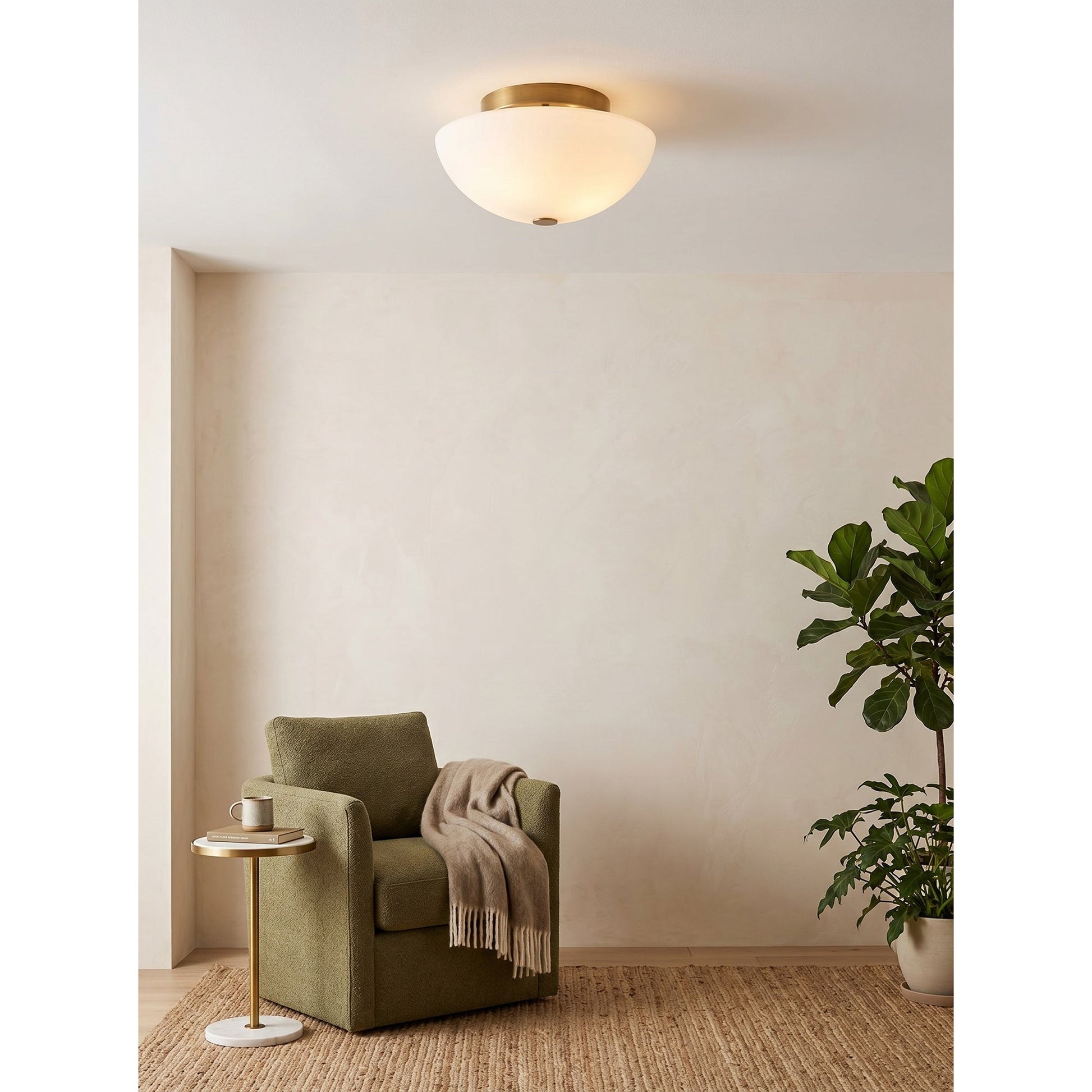 Jeanne flush mount light installed in a minimalist bedroom.