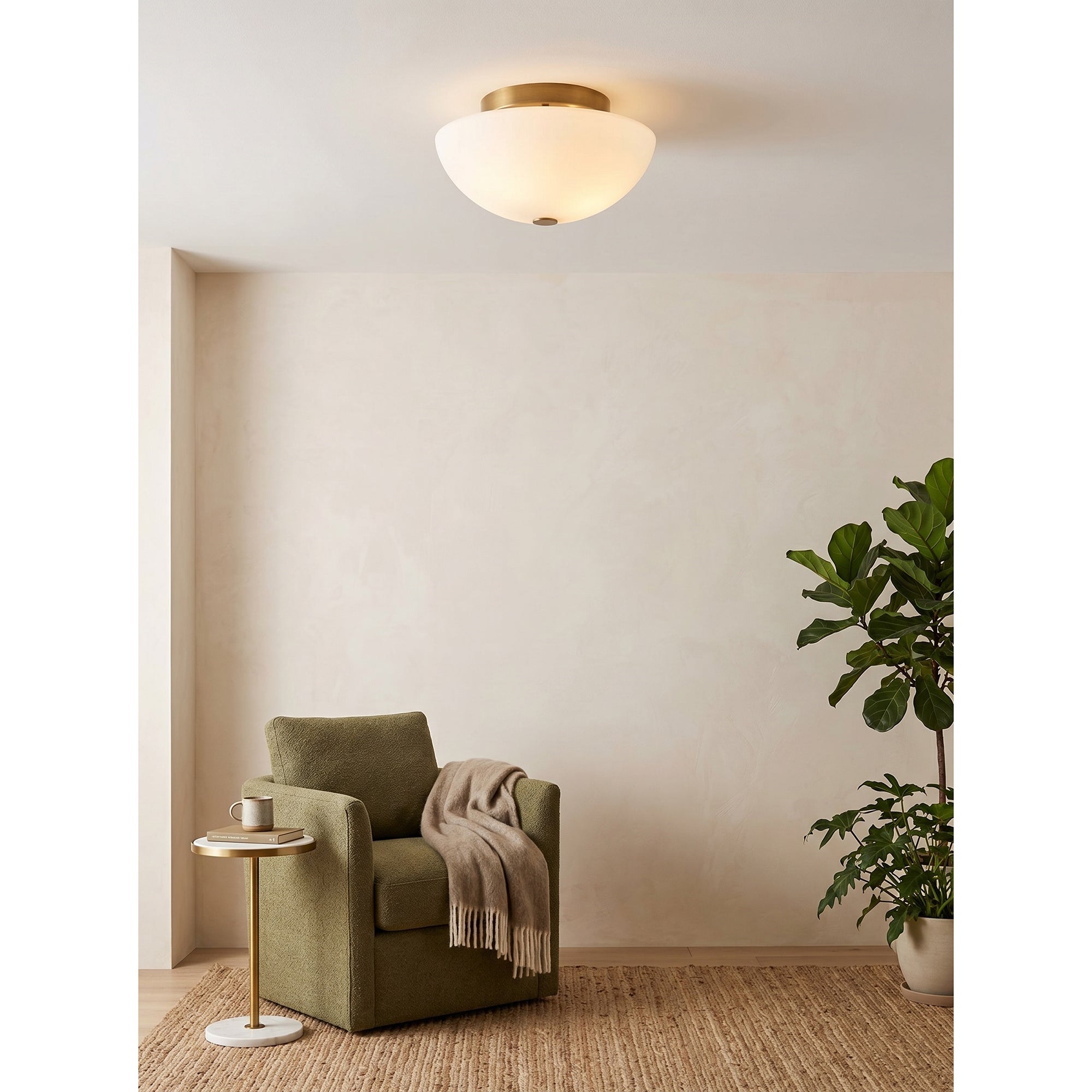 Jeanne flush mount light installed in a minimalist bedroom.