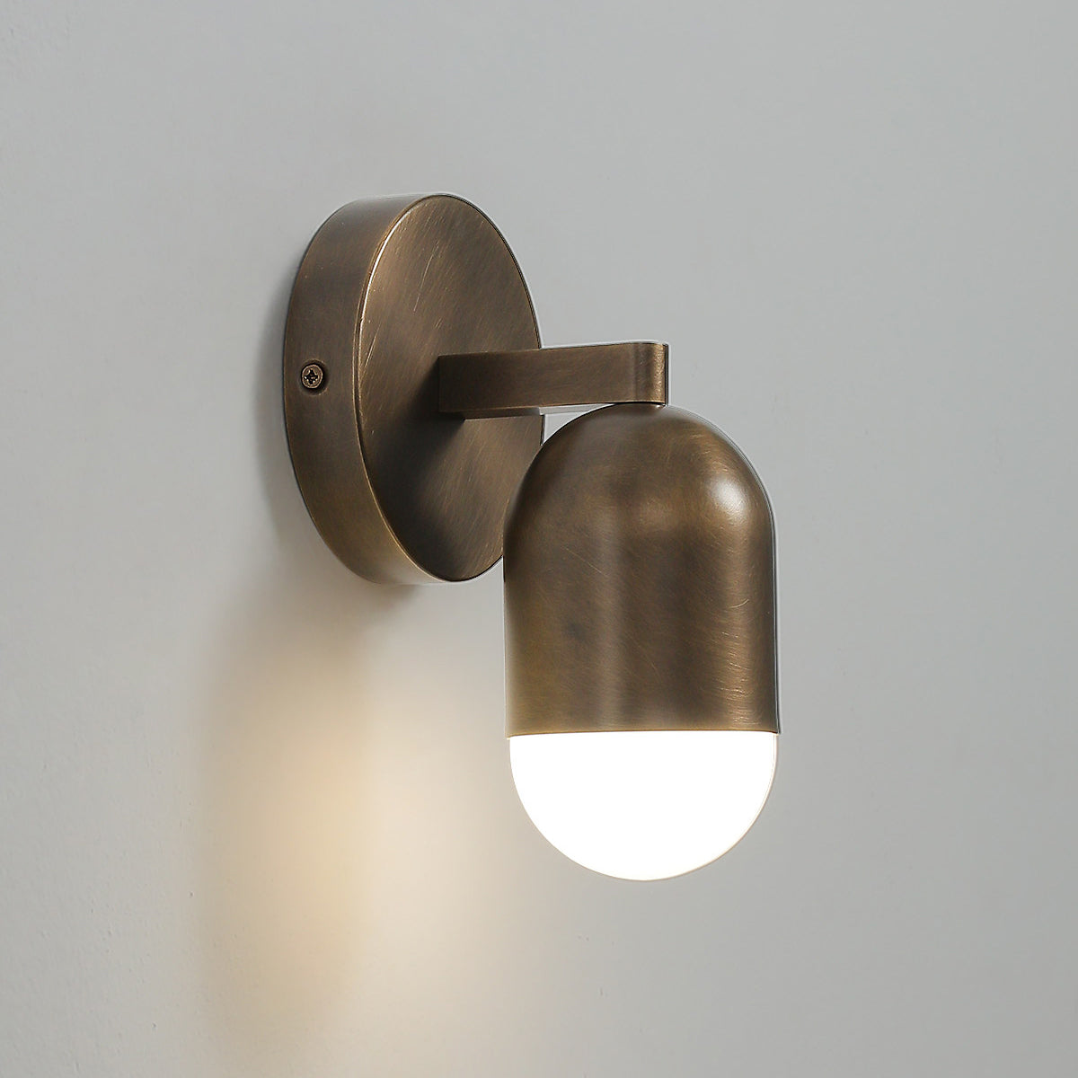 Close-up on the brass body of the Jensen Wall Sconce.